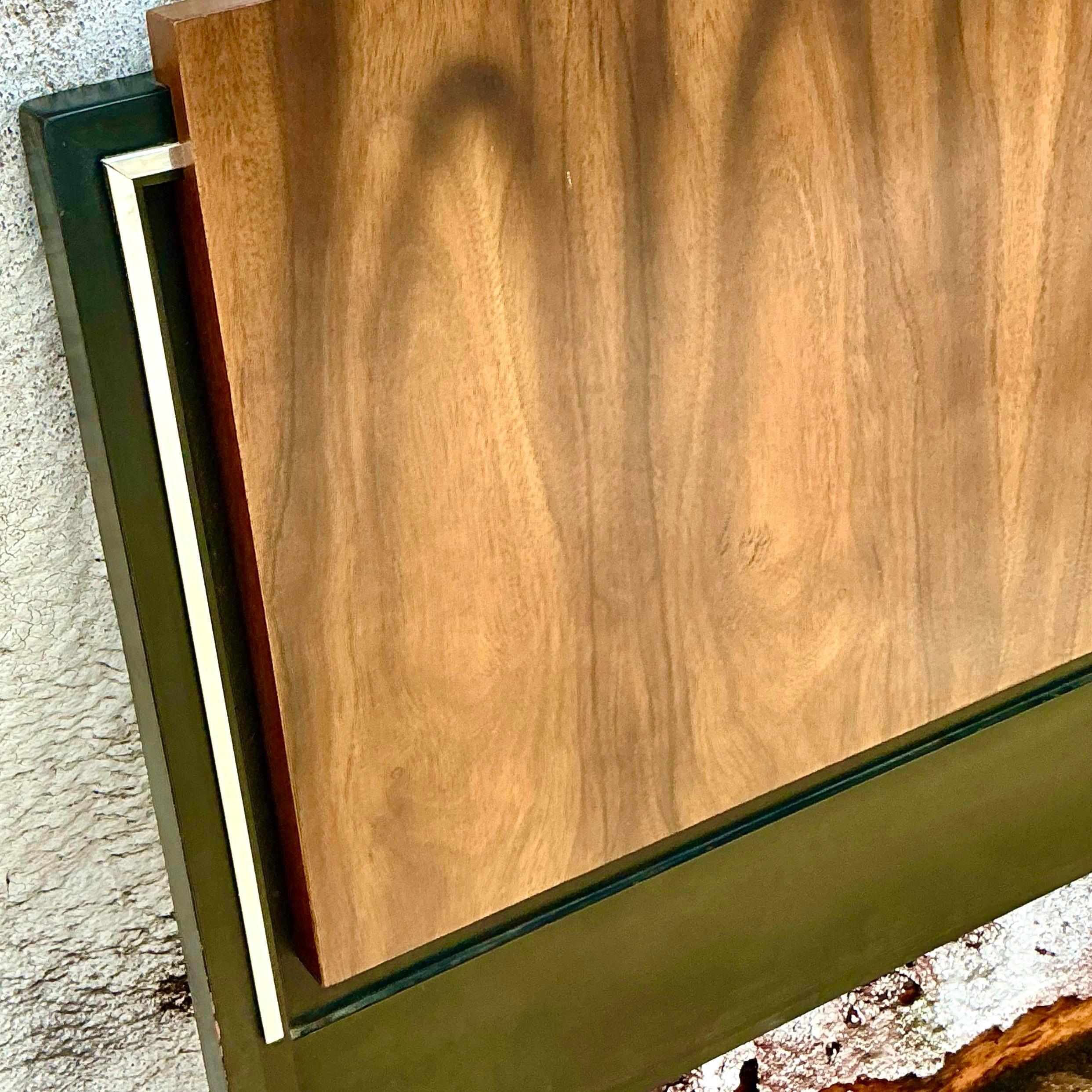 Elevate your bedroom with this vintage MCM chrome-trimmed queen headboard. The rich wood finish paired with sleek chrome accents embodies mid-century modern sophistication. Perfect for adding a bold, retro touch to your space, this headboard