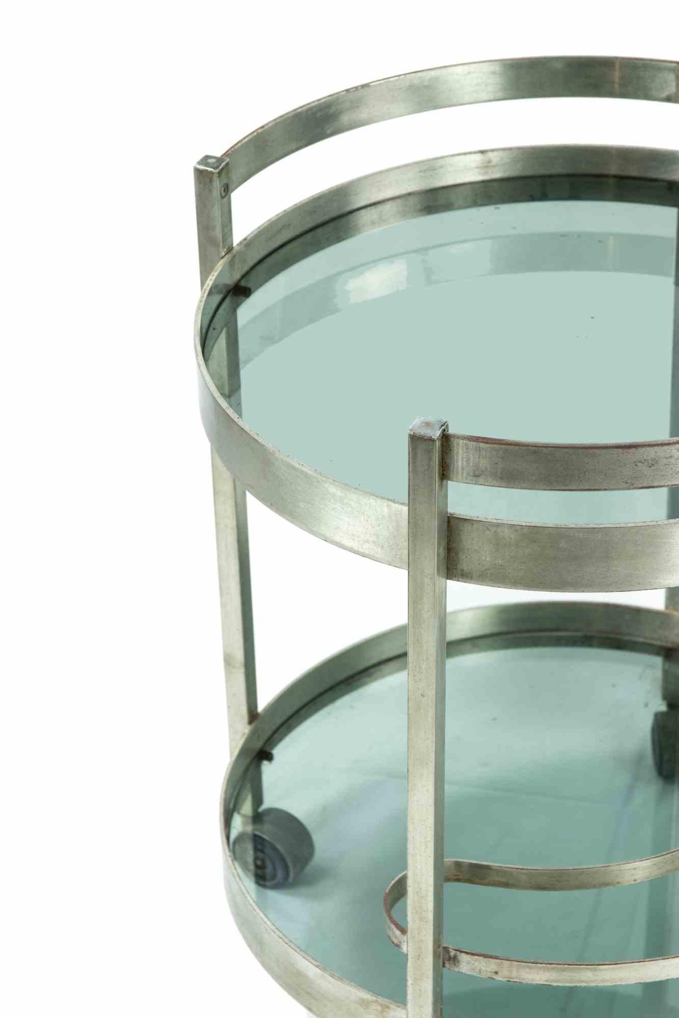 Bar cart is an original design item realized by Italian designer in the 1970s.

A round shape bar cart realized in glass and aluminum chrome plating.

Mint conditions (just some lack of chrome).