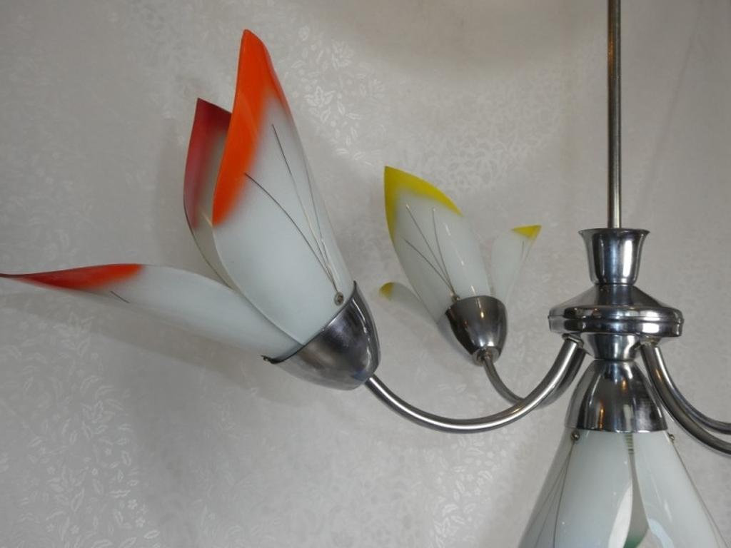 Vintage chromed chandelier with colorful flowers.