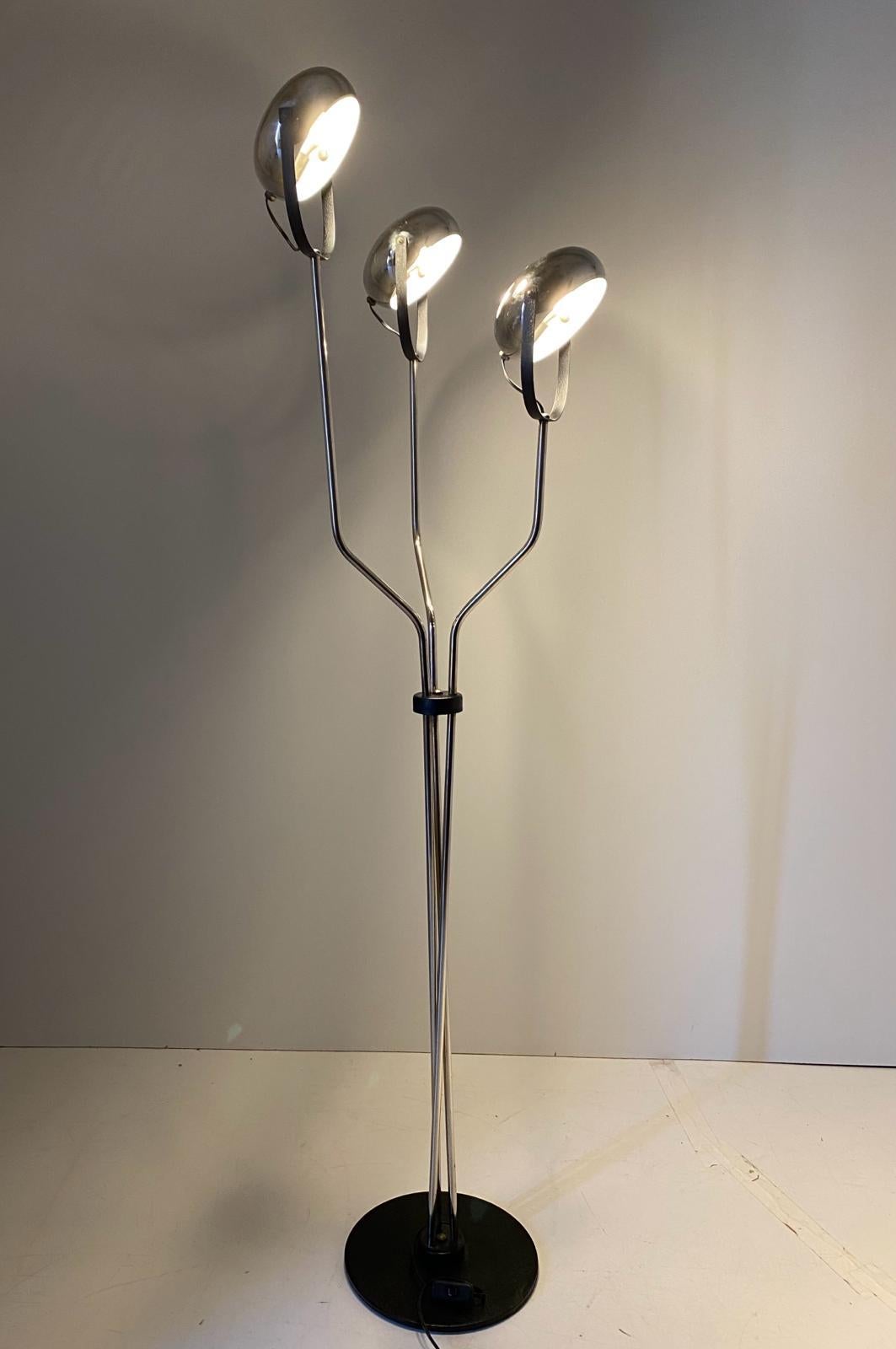 Vintage chromed floor lamp manufactured in Italy in the 1960s from Reggiani. 

Three adjustable lights spots and steel base. Completely restored as follows: Revised and rewired, Chromed has been polished, In very good condition with only few signs