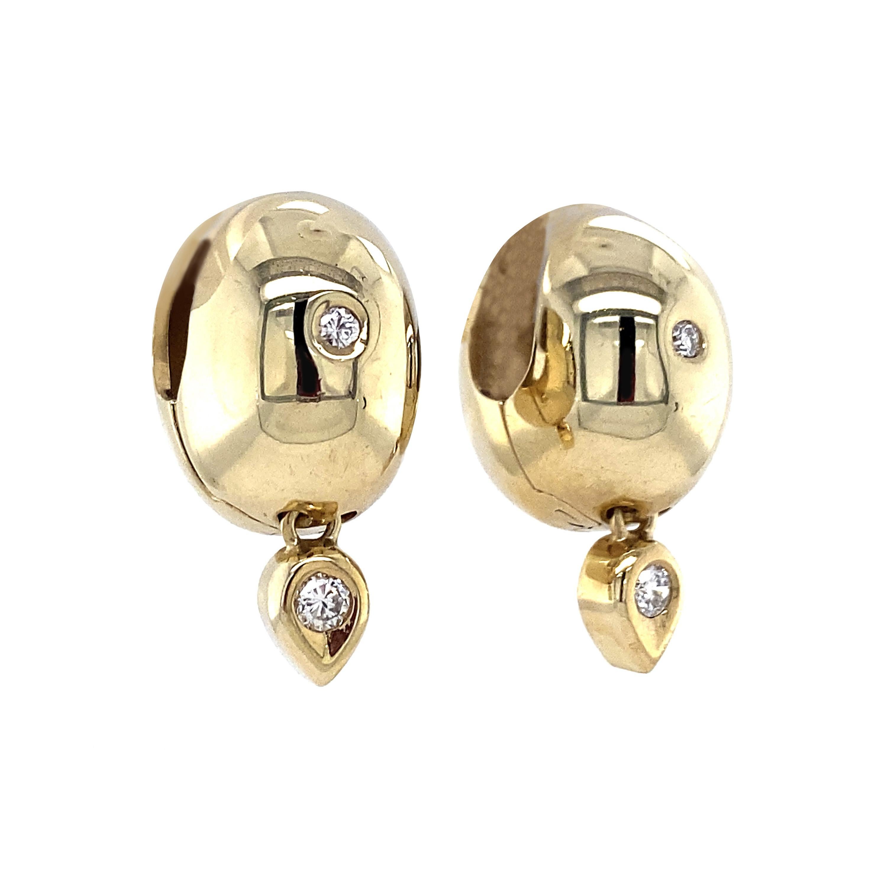 Solid, smooth and statement-worthy, these yellow gold huggie hoops are so ideal whether for a fancy event or for your daily stack. Crafted from 14K yellow gold and set with 0.16 carats total of round brilliant cut diamonds. These hug close to the