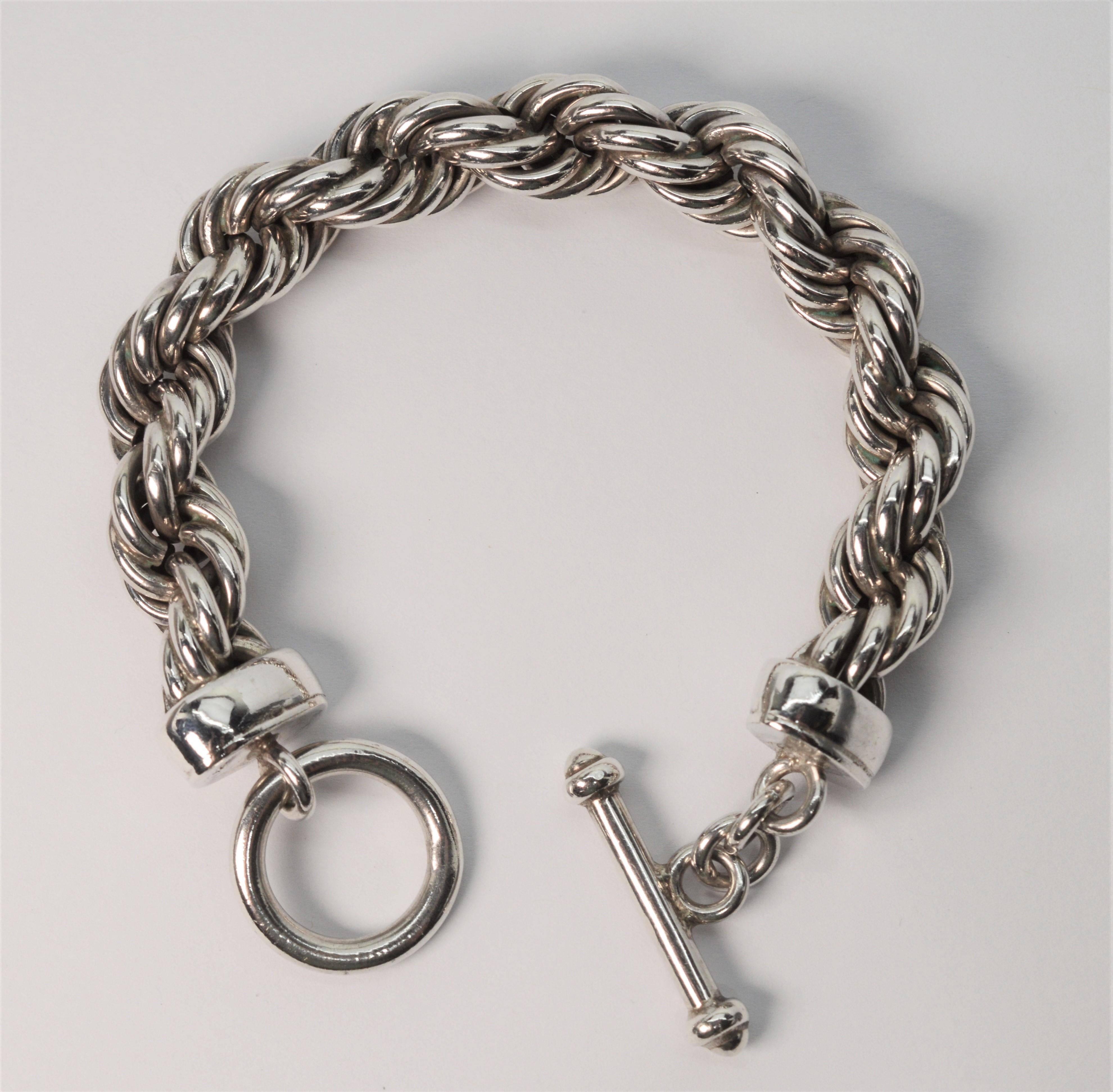 Attention silver lovers, here is a hard to find bold sterling silver bracelet with a substantial profile. This vintage piece is made of 11.5 mm silver rope chain with a interesting twisted weave giving the chain volume. The bracelet measures 7.5