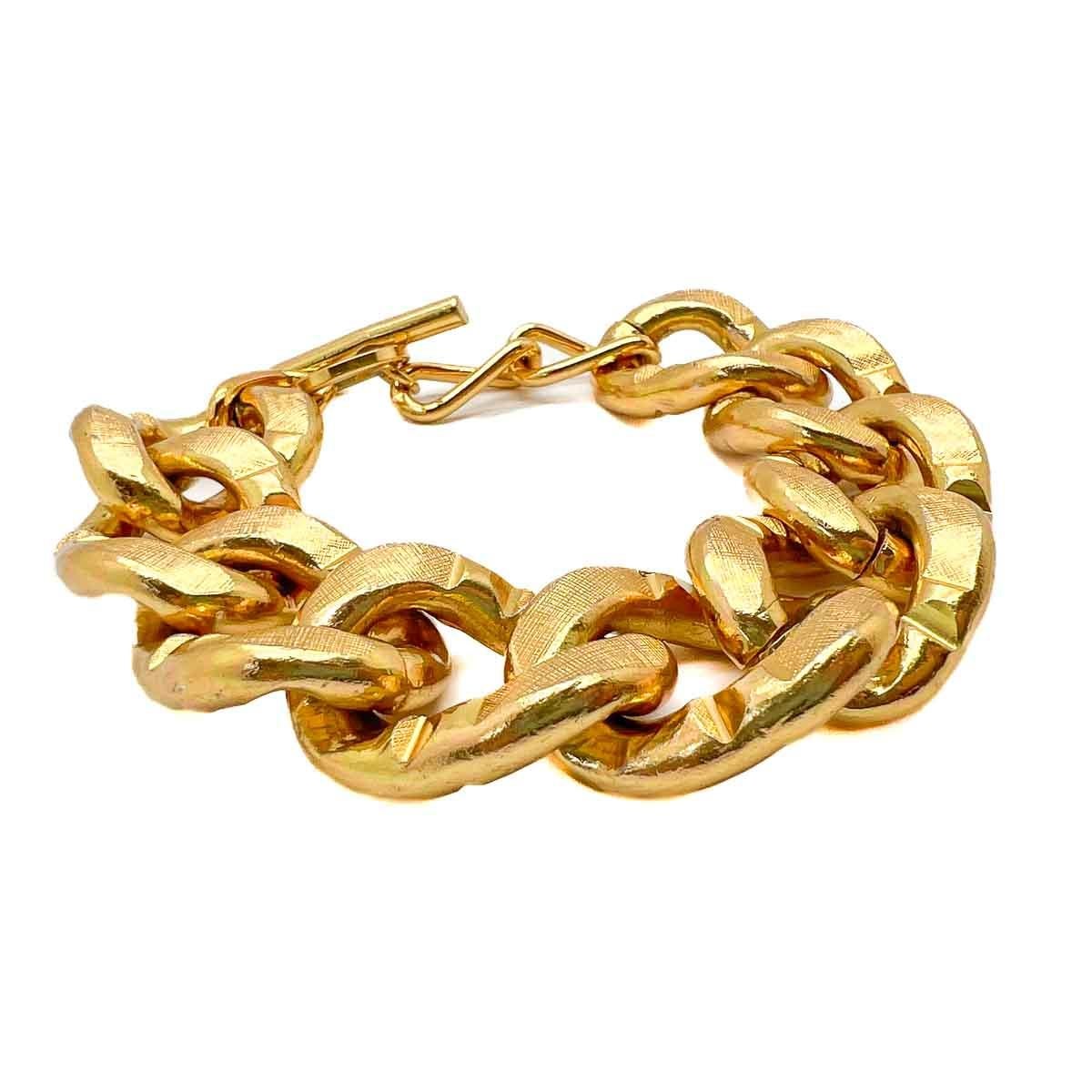 A Vintage Chunky Textured Curb Bracelet. Fabulous grand links to wrap around the wrist, finished to perfection with textured patterning. A timeless classic.

An unsigned beauty. A rare treasure. Just because a jewel doesn’t carry a designer name,