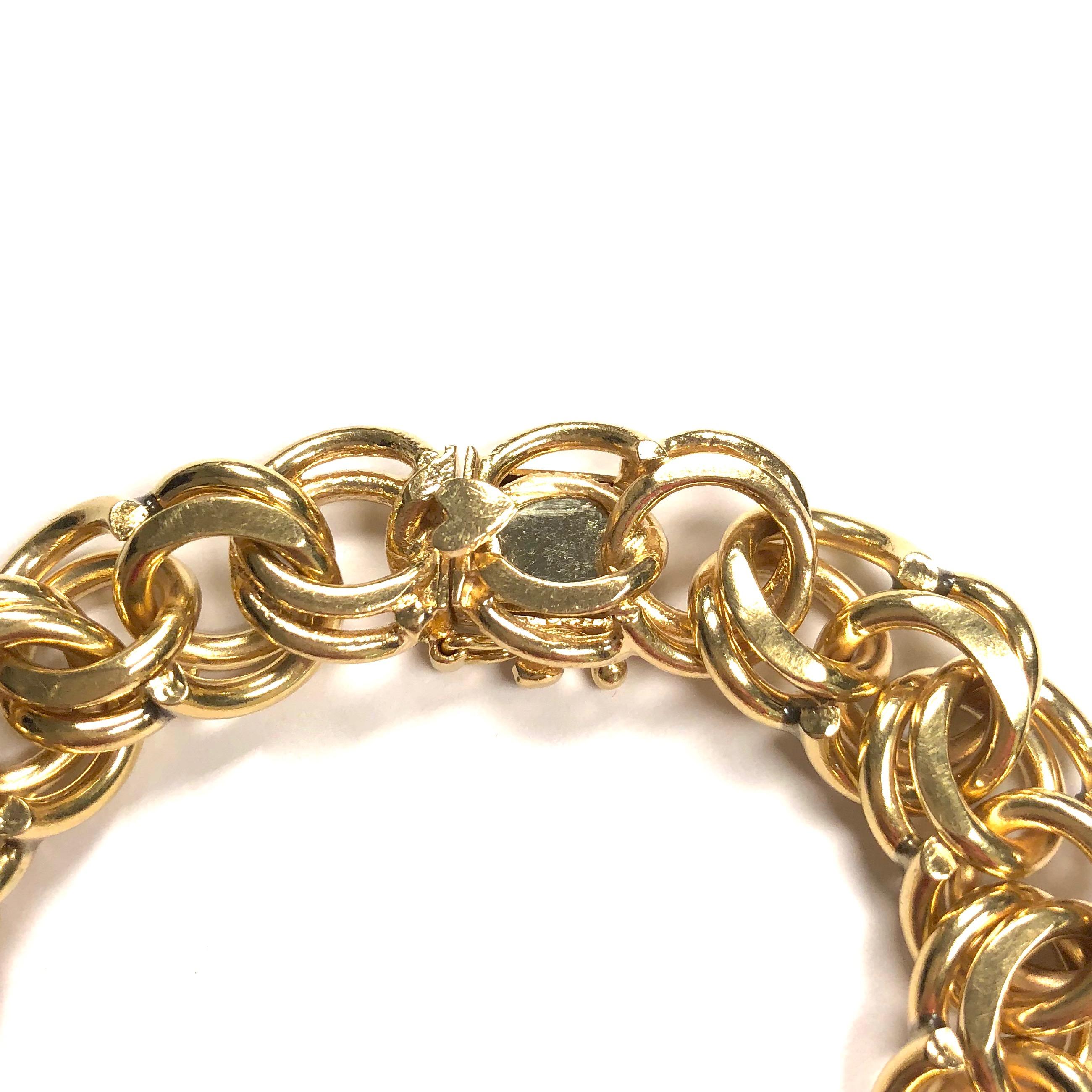 Crafted in 14K yellow gold, the bracelet is composed a series of interlocking solid gold links. Ready for any size charm collection, small or big, heavy or light. 
Measurements: 
Length: 7.25 inches
Width: 0.56 inches
Weight: 63.2 grams
