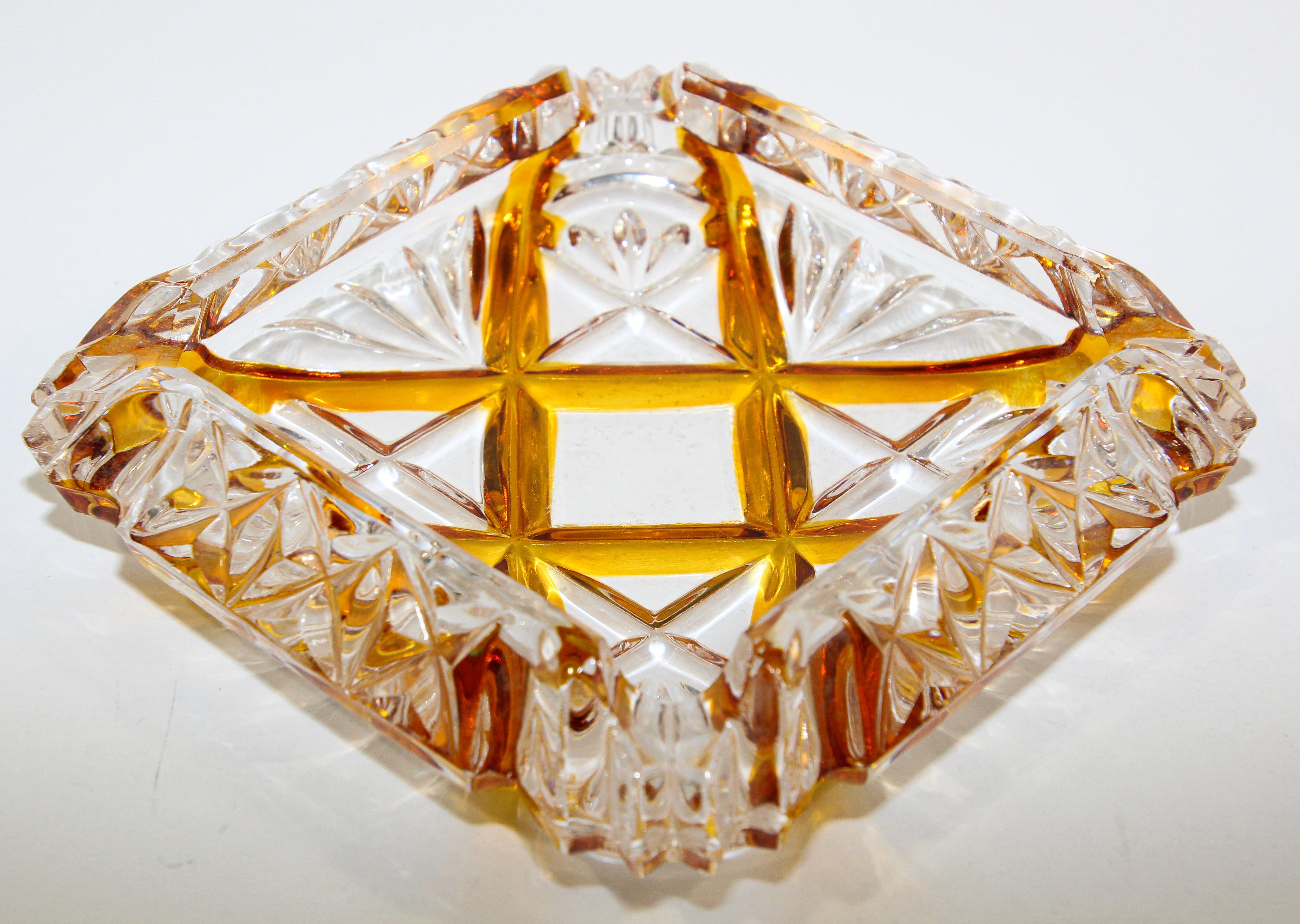 Exceptional luxury Art Deco Bohemian Karl Palda crystal cut ashtray.
Stunning Art Deco details like the streamlined shape with cut-glass engraved pattern combining geometrical details with amber color glass.
This Art Deco glass ashtray was designed