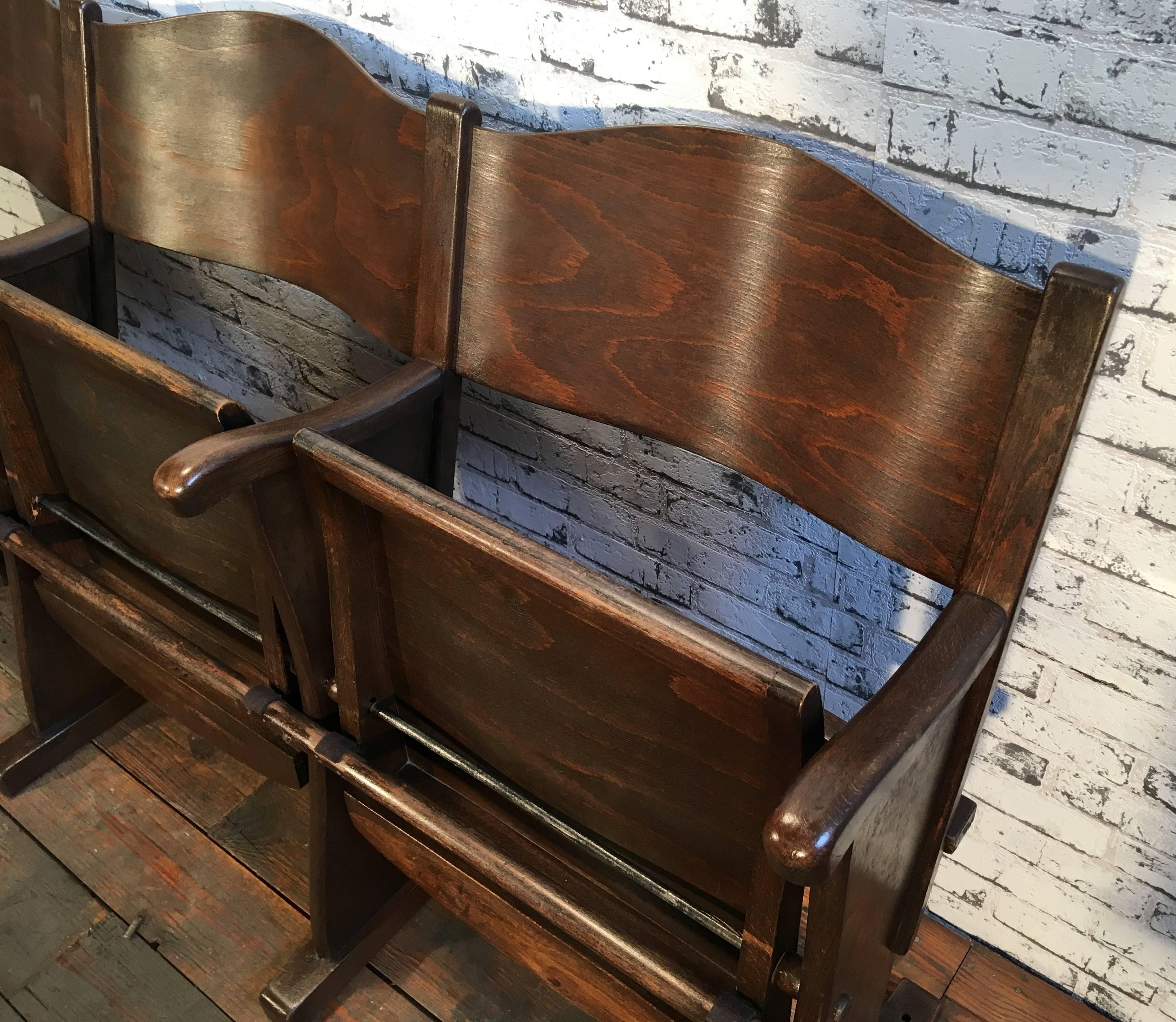 This three-seat cinema bench was produced  in former Czechoslovakia during the 1950s. The chairs are stable and can be placed anywhere. It is completely made of wood (partly solid wood, partly plywood). The seats fold upwards. The weight of the