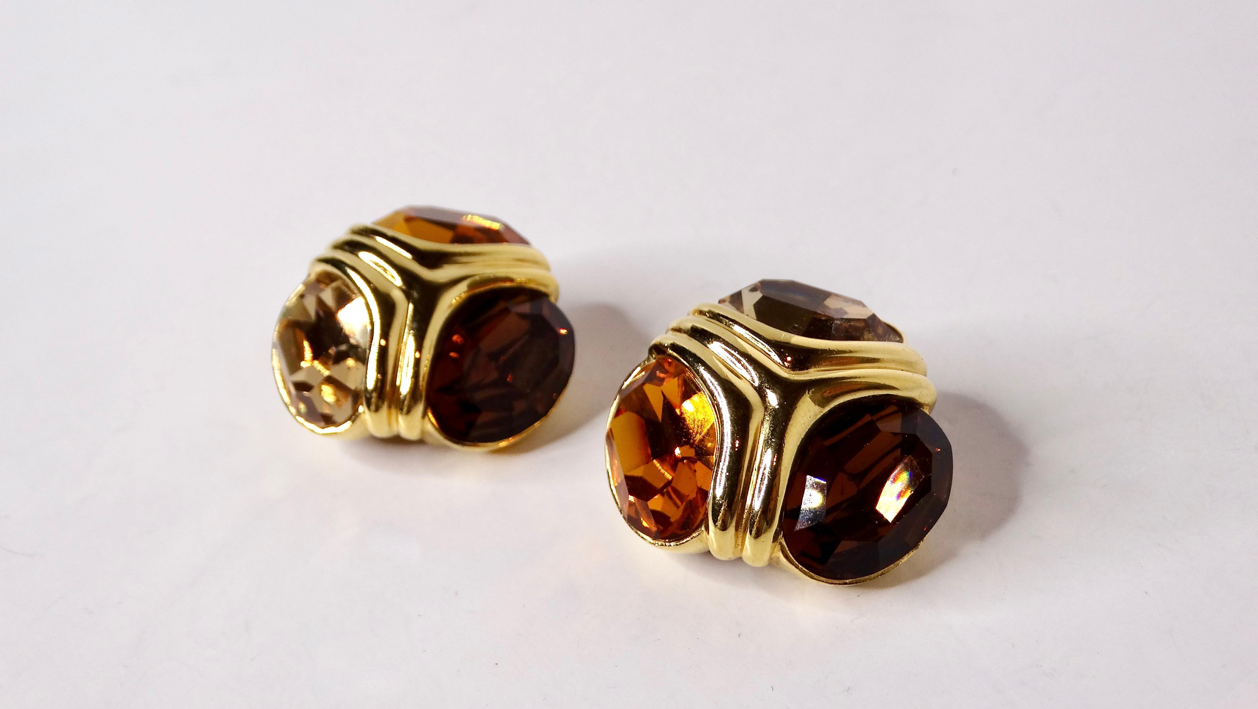 Indulge in the timeless allure of these Vintage Ciner 18k Gold Plated Citrine-Tone Clip-On Earrings, elegantly designed with three stunning shades of citrine-tone crystals. These captivating earrings showcase a harmonious blend of warm hues that