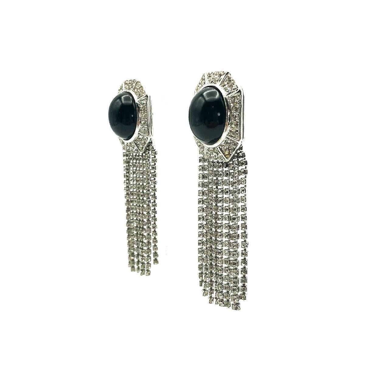 A spectacular pair of Art Deco inspired vintage Ciner monochrome fringe earrings. Boasting the incredible quality and style Ciner, NYC is renowned for over the last century. Featuring a large dramatic cabochon stone atop a stunning fringe of