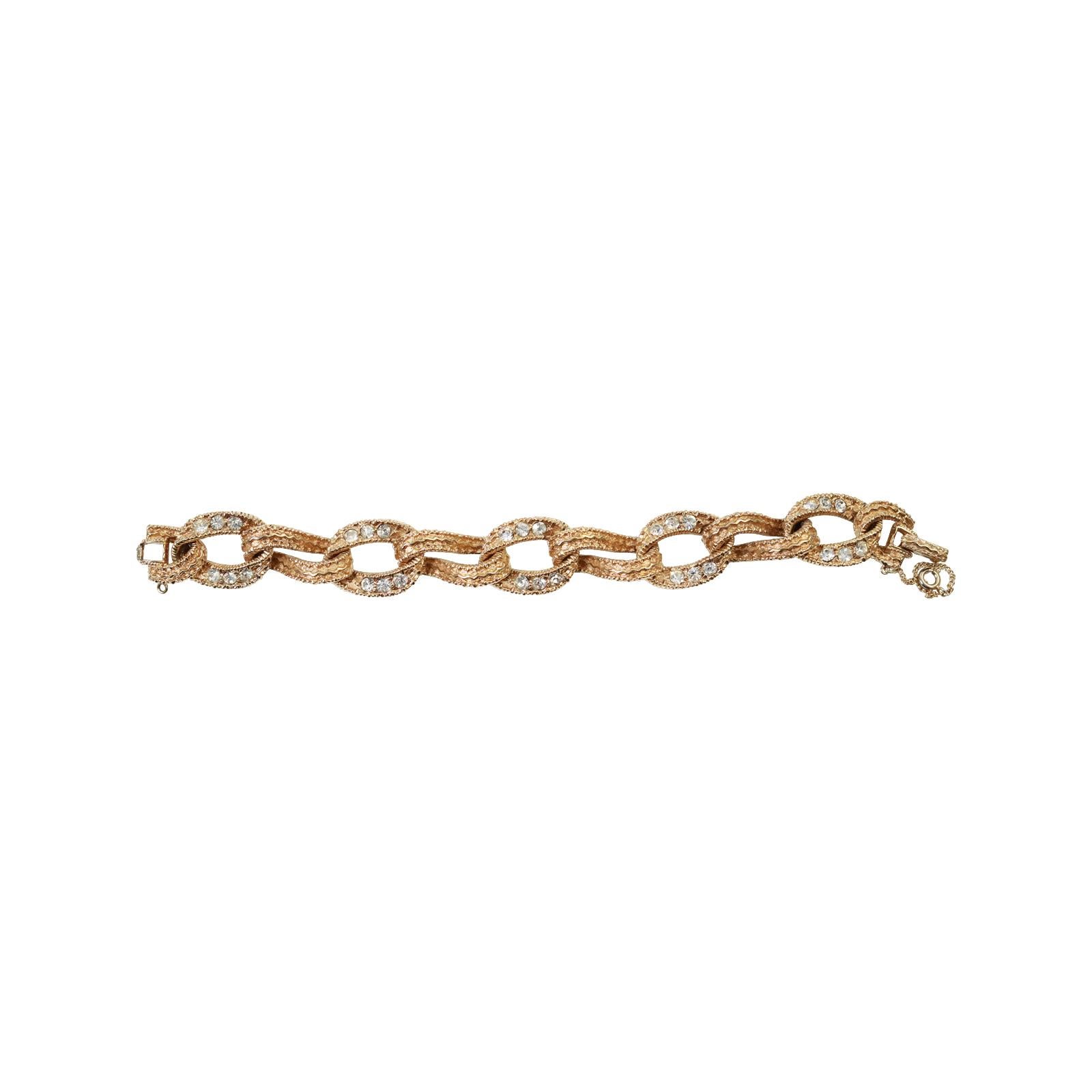 Vintage Ciner Gold Tone Diamante Link Bracelet Circa 1980s.  It is a classic that has been made throughout the centuries.  Will be great stacked up or can be worn alone.  Can be mixed and matched with fine.  Always in style.

Ciner is no longer in