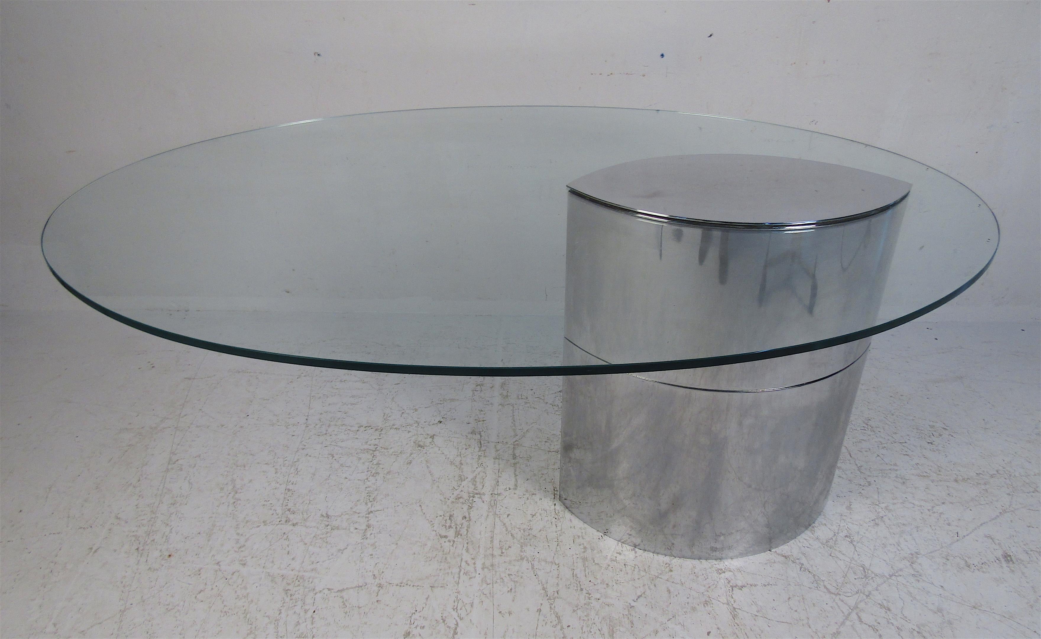 This elegant Mid-Century Modern desk features a polished stainless steel base with a 1/2 inch thick cantilever glass top. By Cini Boeri for Knoll International. The oval glass top has, 