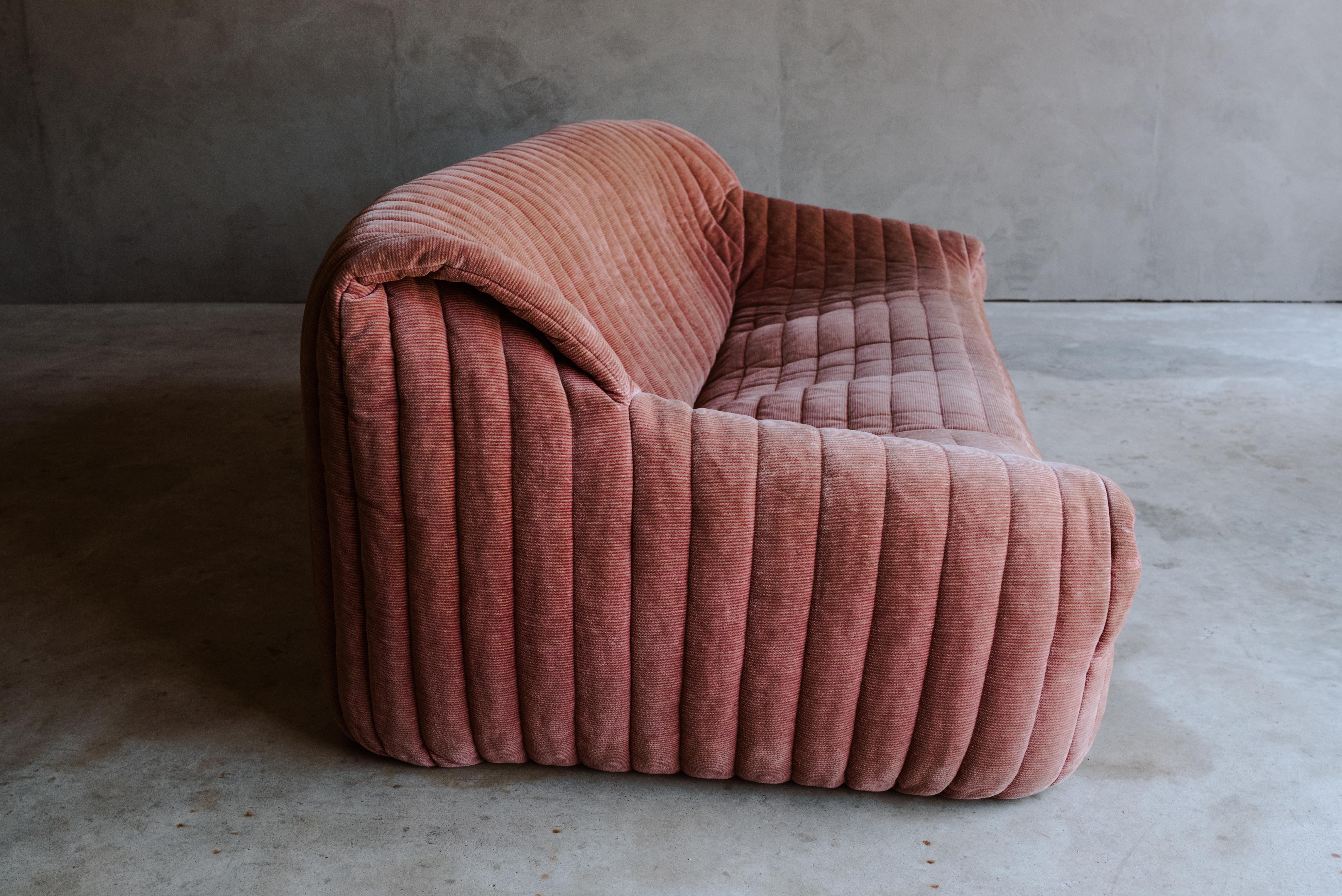 Vintage Cinna leather sofa sandra by Annie Hieronimus, Circa 1970. Original coral fabric upholstery with light wear and use. Manufactured by Ligne Roset, France.