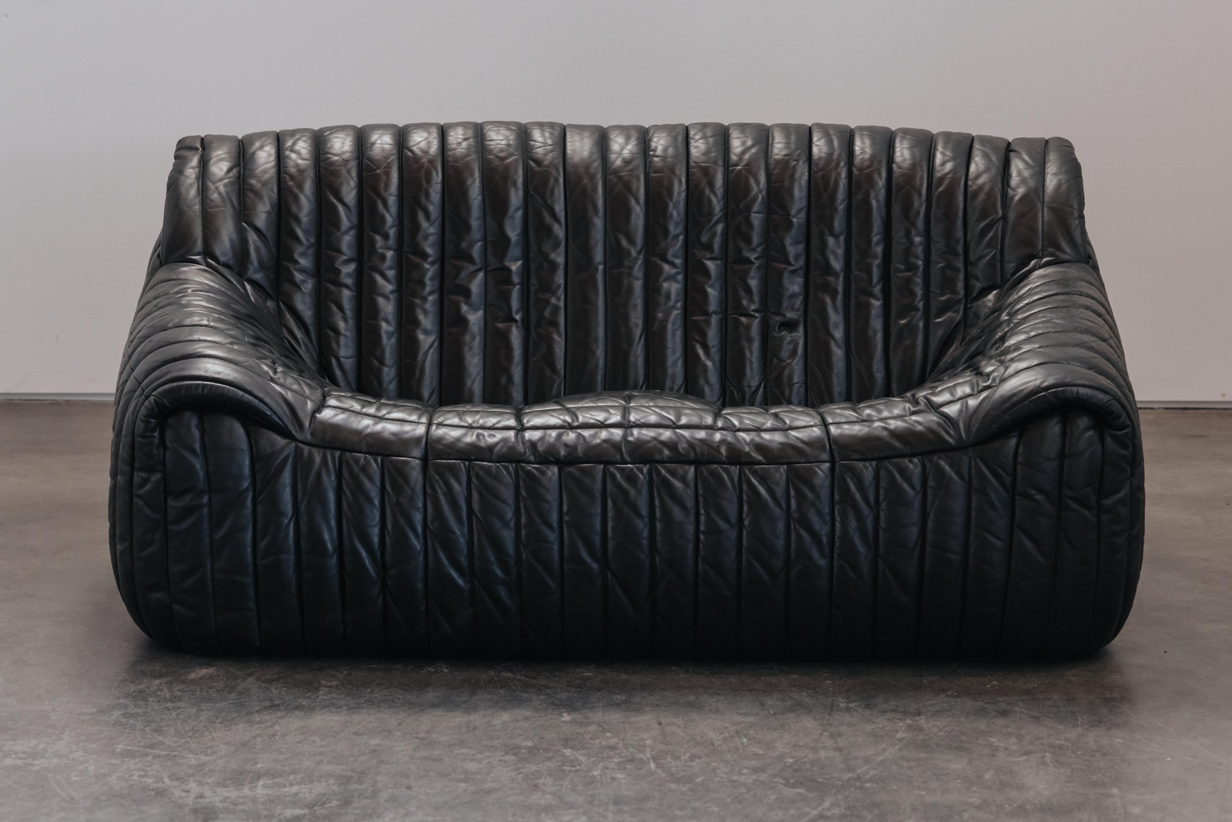 Vintage Cinna Loveseat Sofa By Ligne Roset, Circa 1970.  Original black leather upholstery with very light patina and use.