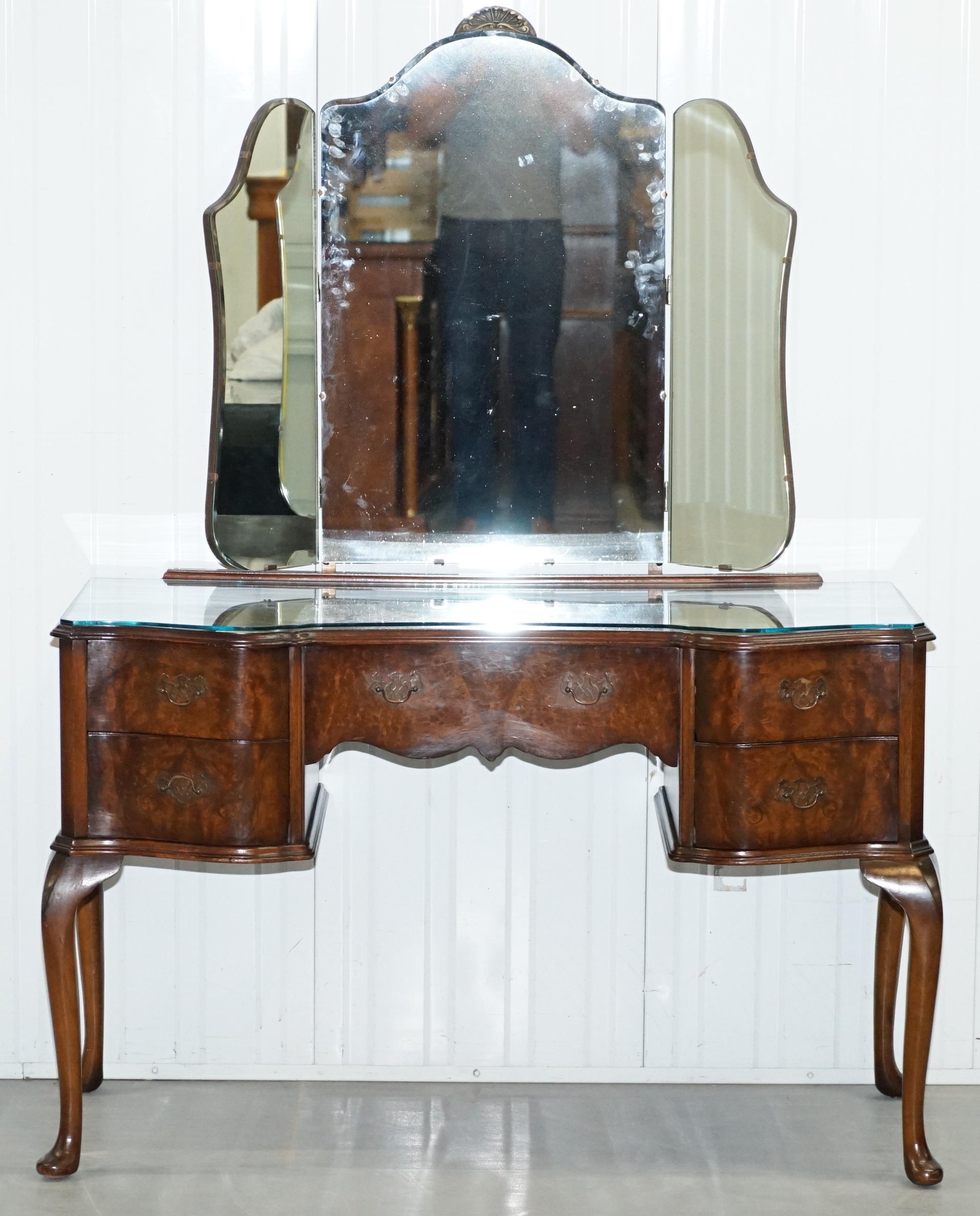 Wimbledon-Furniture is delighted to offer for sale this lovely handmade in England vintage 1930s Butilux quarter cut Walnut dressing table with tri fold mirrors 

Please note the delivery fee listed is just a guide, it covers within the M25 only,