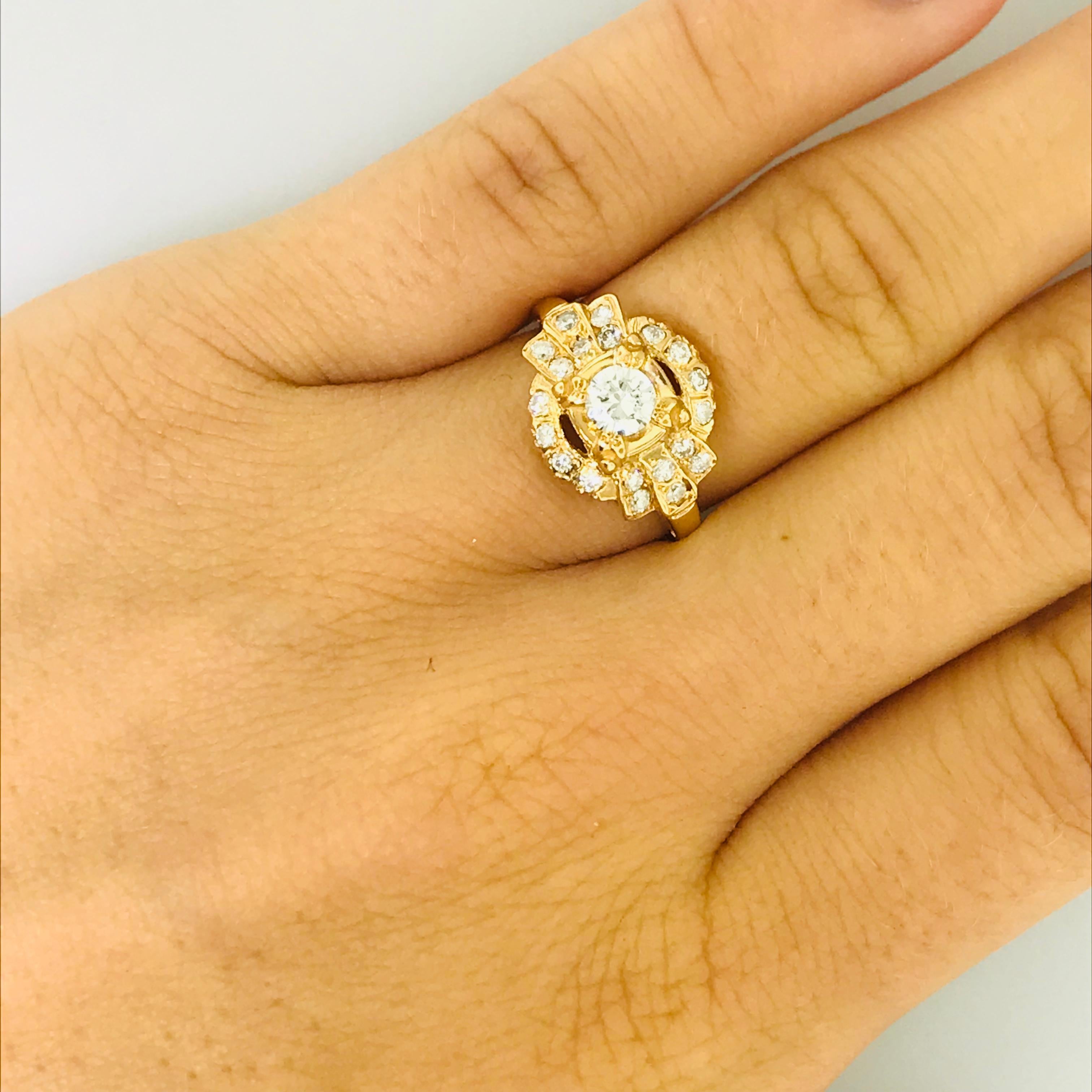 This diamond engagement ring is very special and vintage, CIRCA 1935. The vintage diamond engagement ring is a 14k yellow gold ring with a unique diamond design on top. In the center there is a round brilliant diamond that weighs .35 carat.