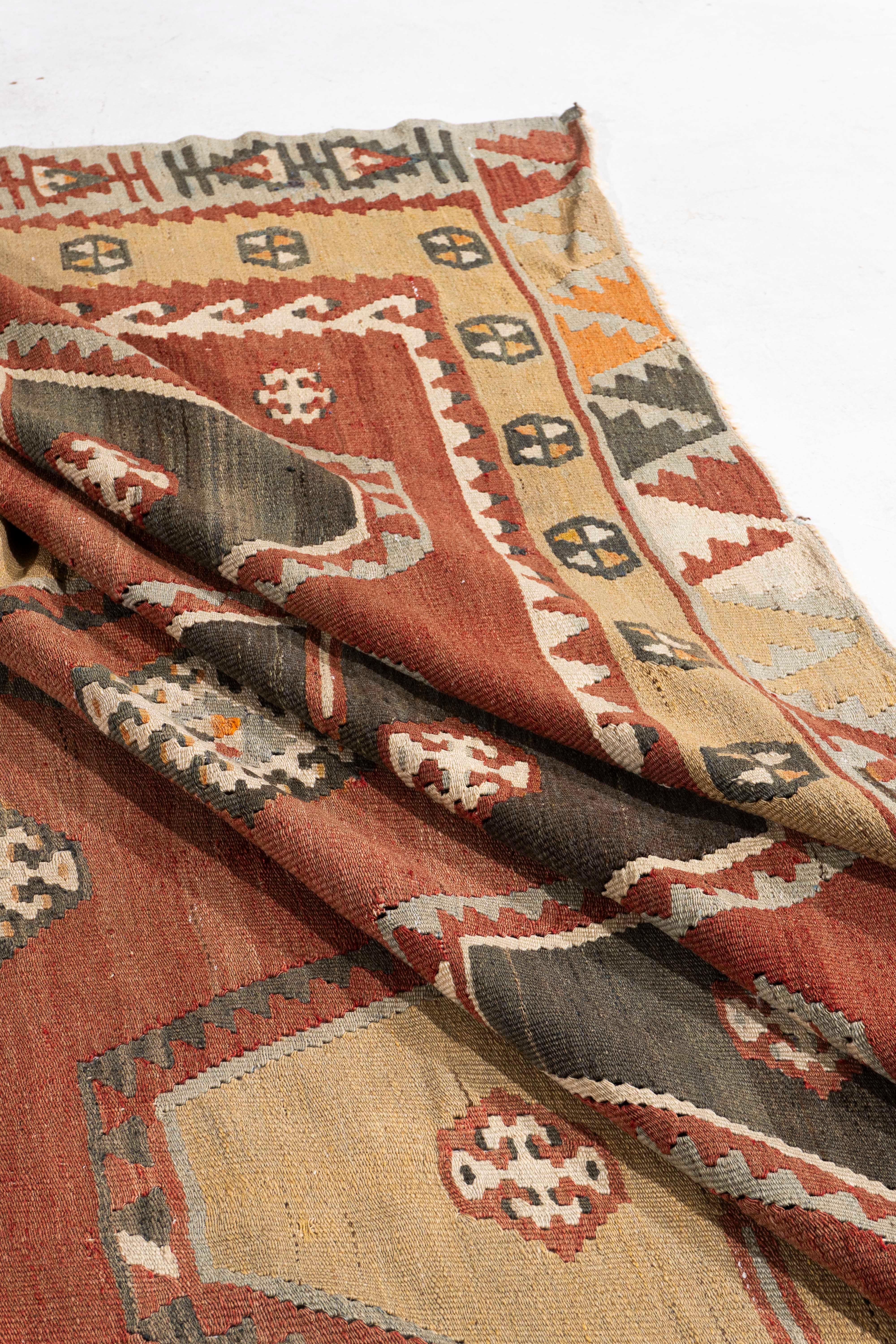 8'7 X 11'7. This vintage Turkish flat weave Kilim is hand-woven. The simplicity and boldness of this piece can also give a contemporary feel and is able to look at home in both a modern and traditional setting. The geometric design in soft colors is