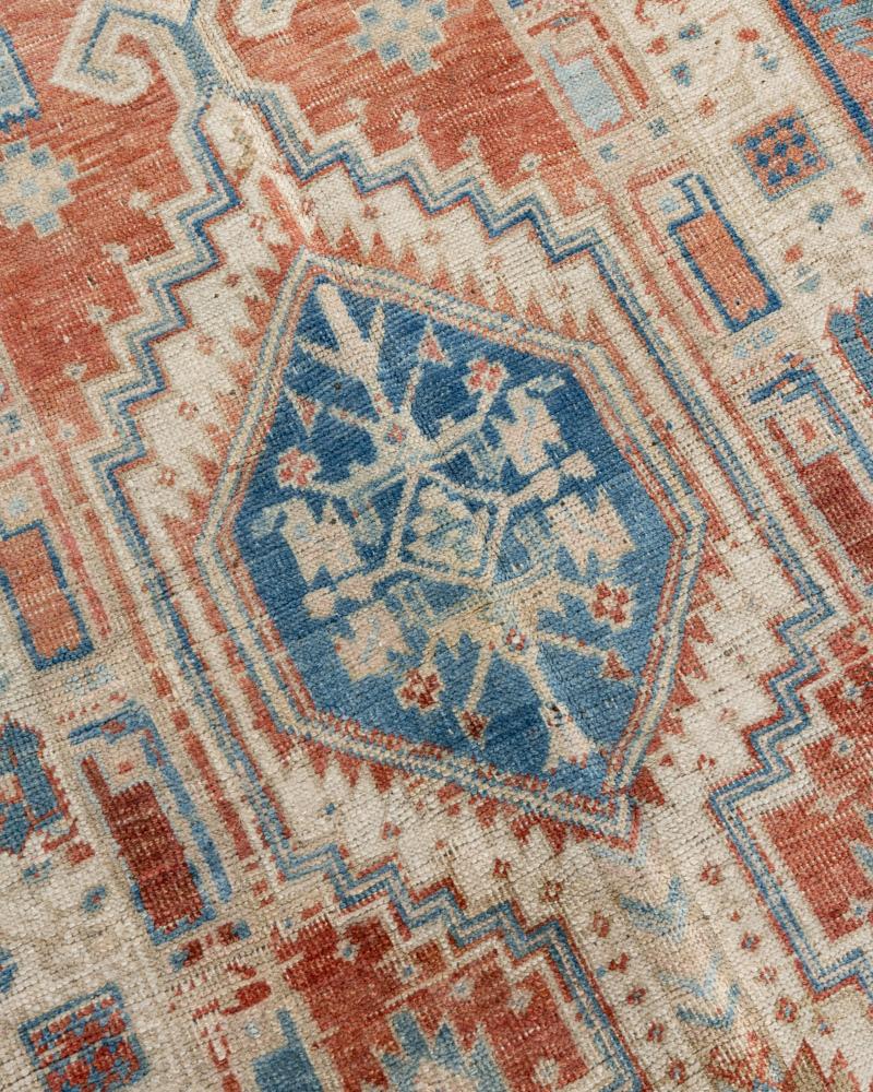 Vintage Persian Heriz runner 3' x 14'7. As perpetually fashionable as they are collectible, traditional Heriz luxury handmade rugs are skillfully woven in vibrant colors and emphatic geometric designs. The Heriz district of NW Persia has been