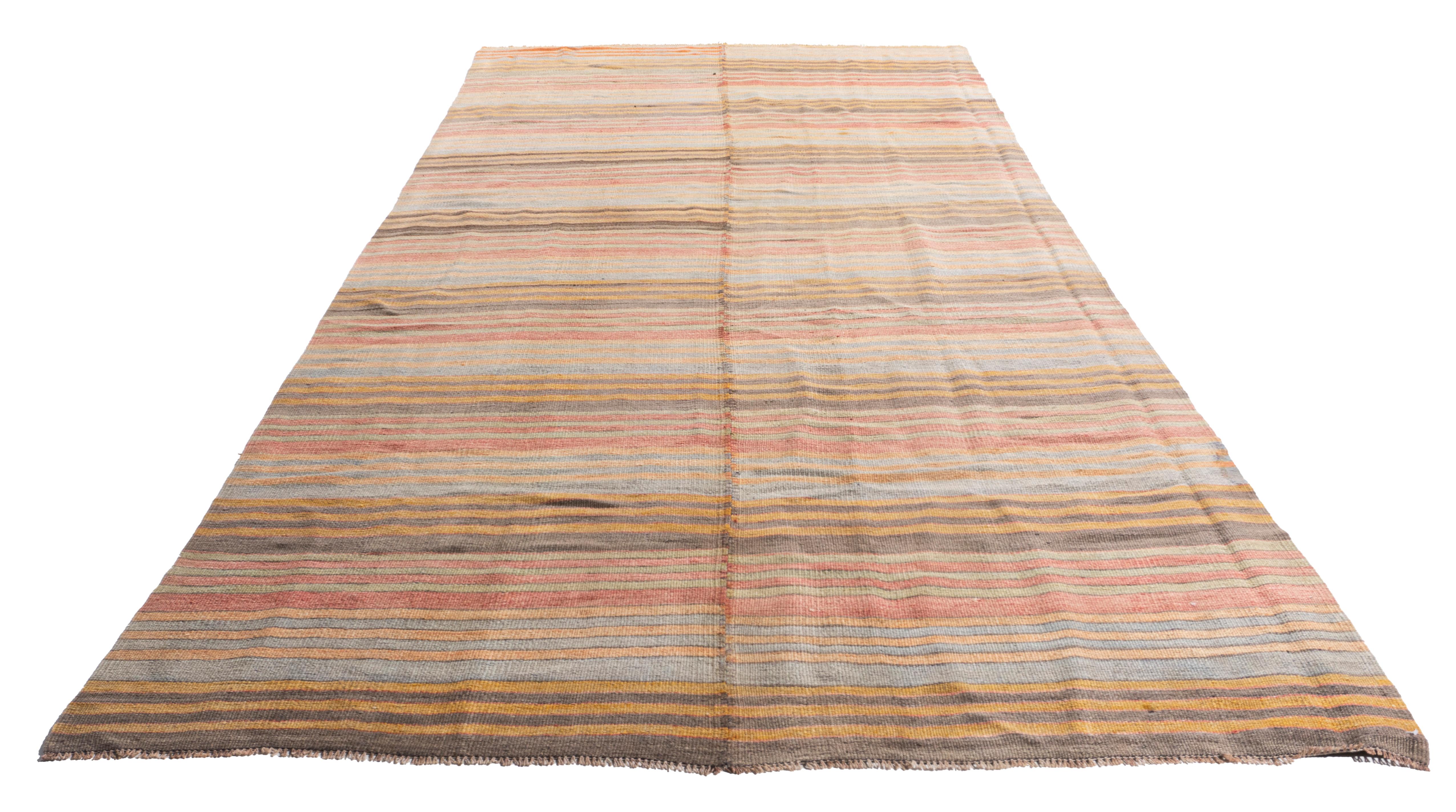 4'10 X 10'11. This vintage Turkish flat weave Kilim is hand-woven. The simplicity and boldness of this piece can also give a contemporary feel and is able to look at home in both a modern and traditional setting. The geometric design in soft colors