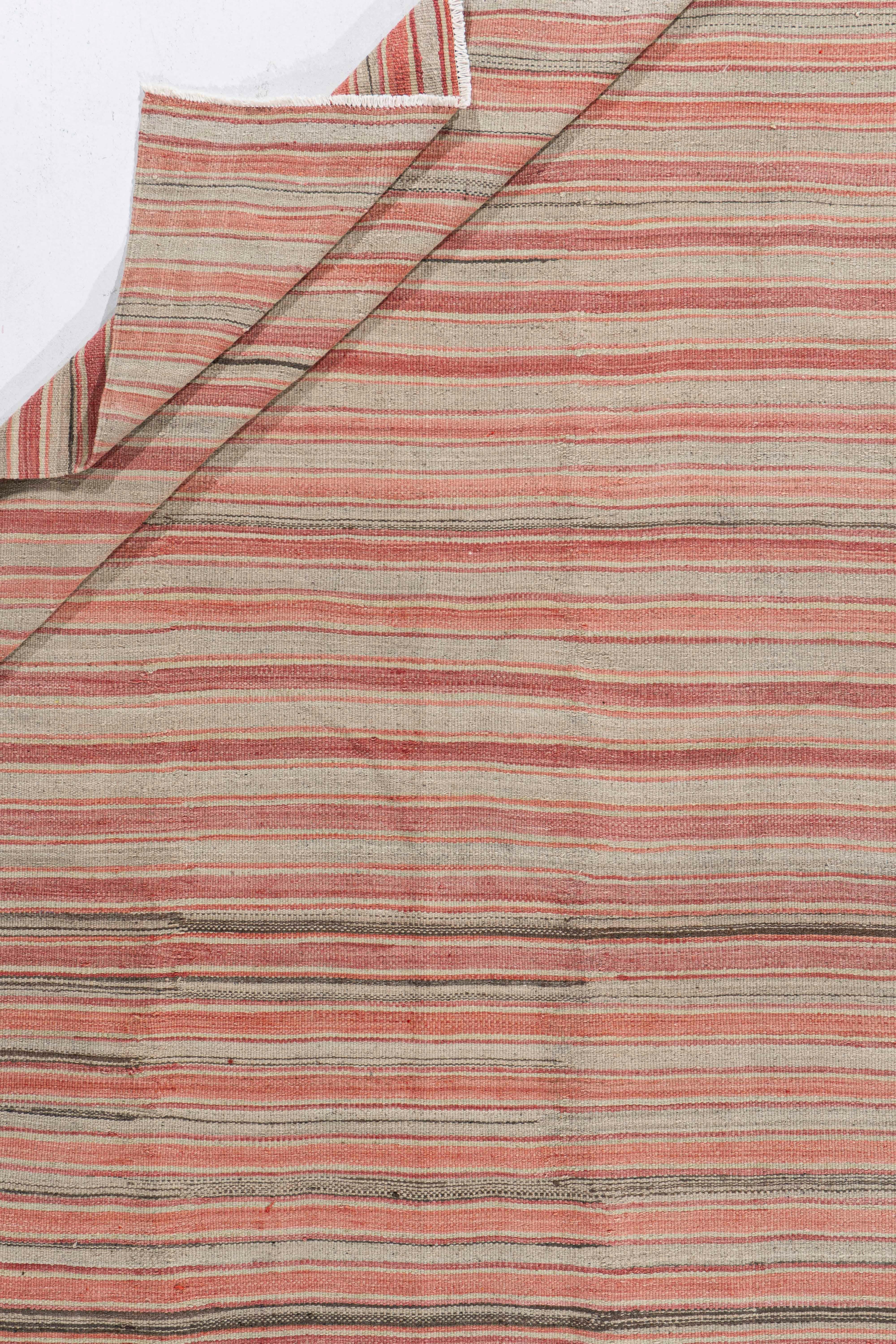 5'3 X 9'3. This vintage Turkish flat weave Kilim is hand-woven. The simplicity and boldness of this piece can also give a contemporary feel and is able to look at home in both a modern and traditional setting. The geometric design in soft colors is