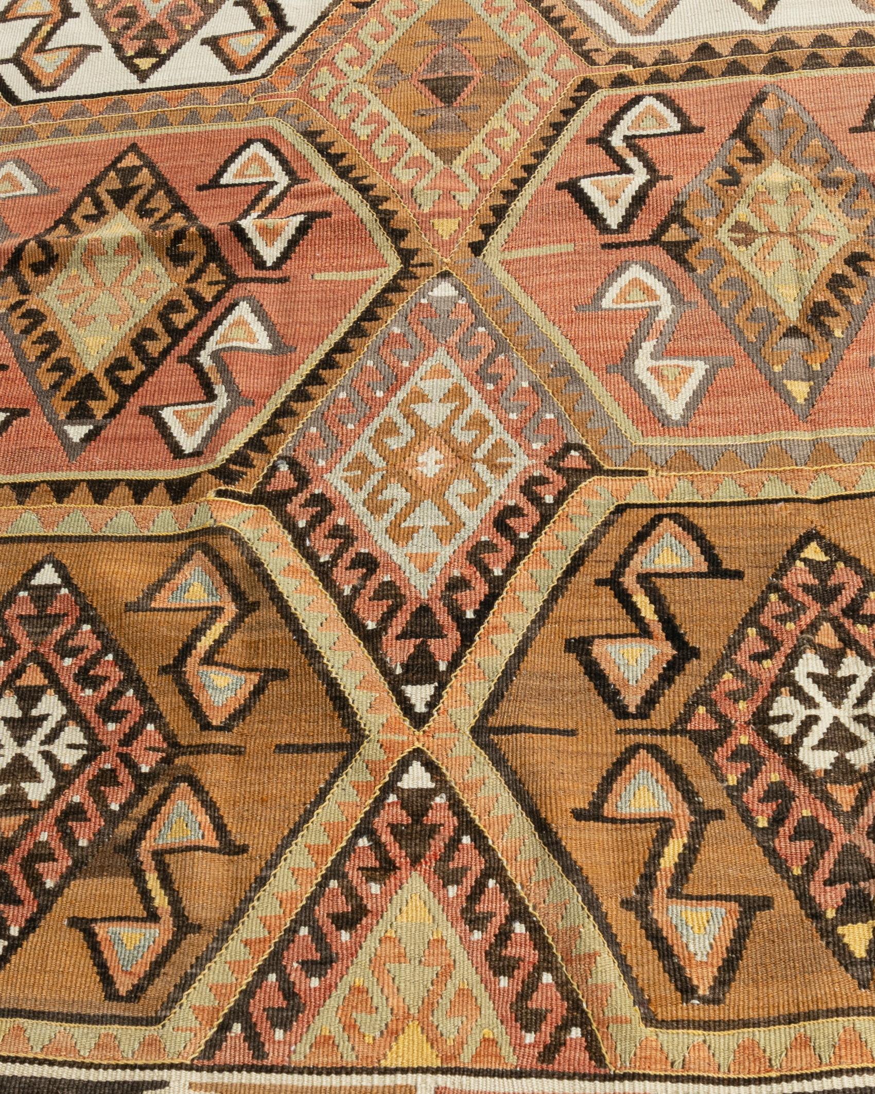 Vintage Circa 1940 Soft Terracotta Turkish Kars Kilim Rug Runner 4'1 X 11'8. This vintage Turkish flat weave Kilim was hand-woven in the 1940's. The simplicity and boldness of this piece can also give a contemporary feel and is able to look at home