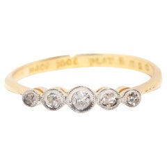 Vintage circa 1940s 18 Carat Yellow Gold Rubover Set Diamond Five Stone Ring