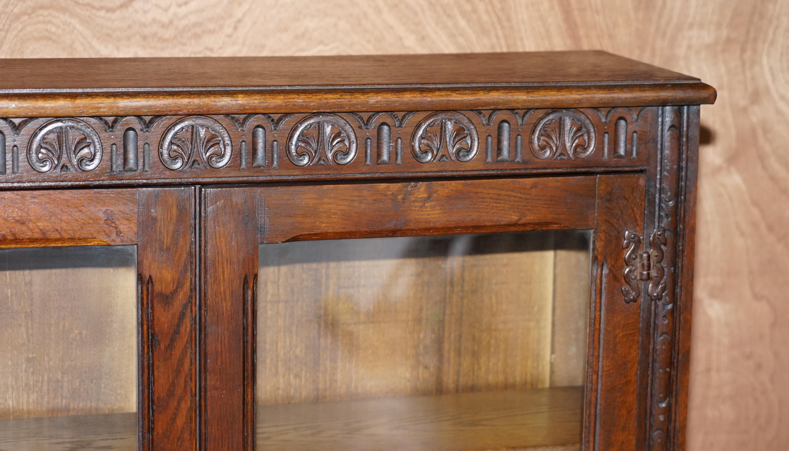 Hand-Crafted Vintage circa 1940's English Oak Jacobean Revival Glazed Door Library Bookcase For Sale