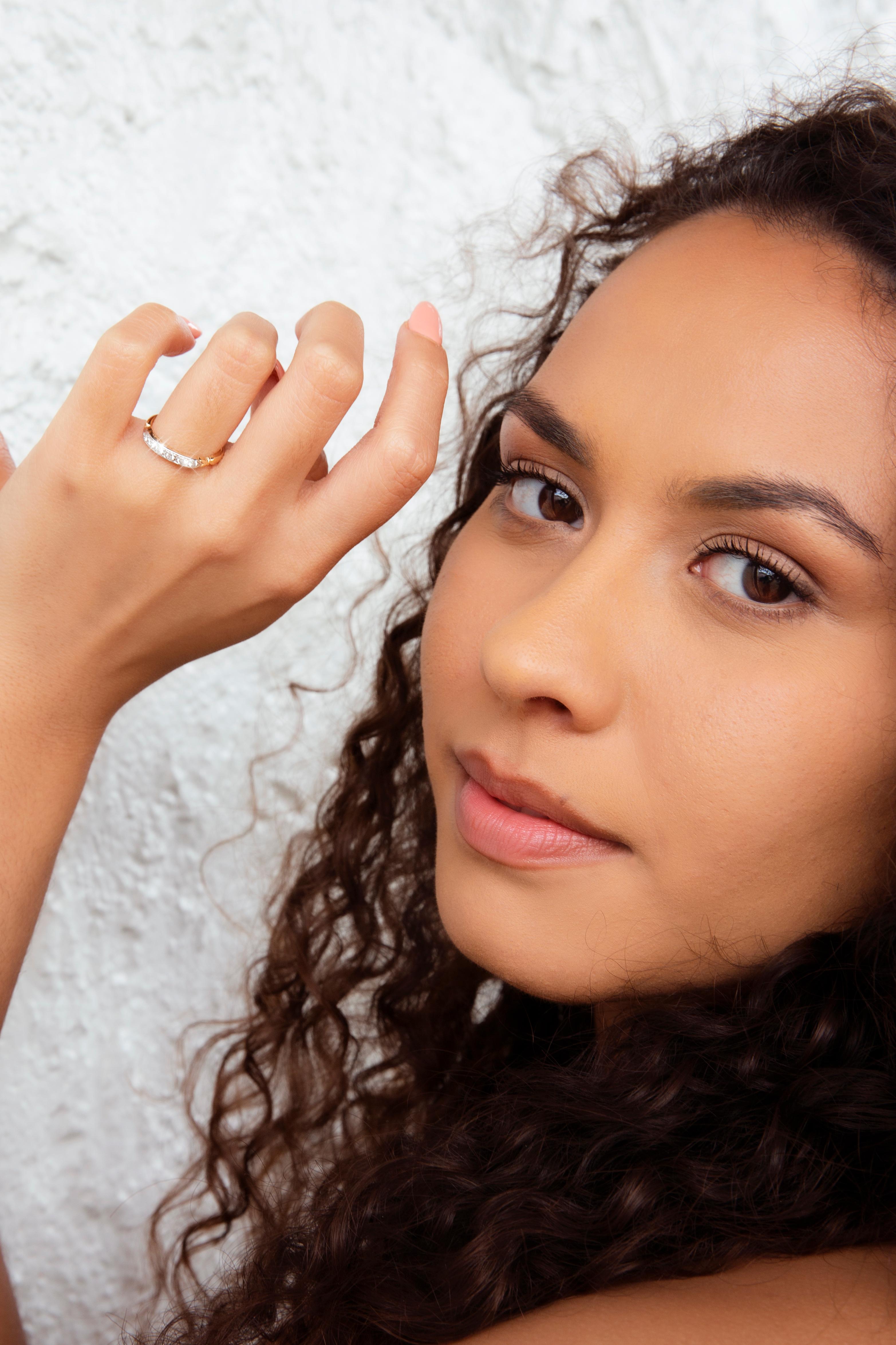 Crafted in 18 carat gold, this darling 1950s vintage ring features a glistening bead set row of round brilliant diamonds across a platinum setting on a gleaming yellow gold band. We have named this piece The Fairbanks Ring. She is perfect for