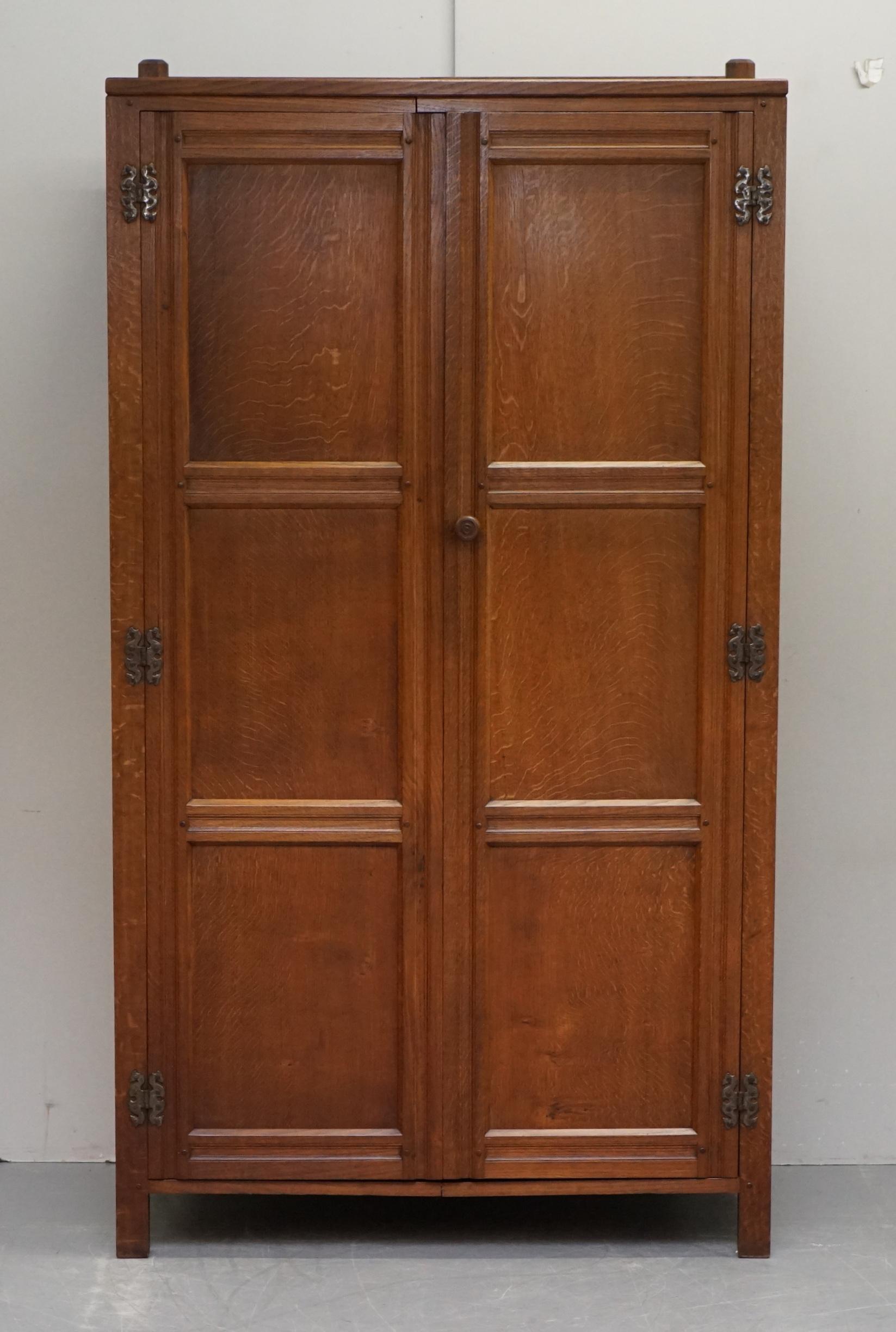 We are delighted to offer for sale this lovely circa 1950s Cotswold School English Oak Wardrobe with twin hanging rails

A very good looking well made and traditional English wardrobe. This piece comes with all the original hardware which is very