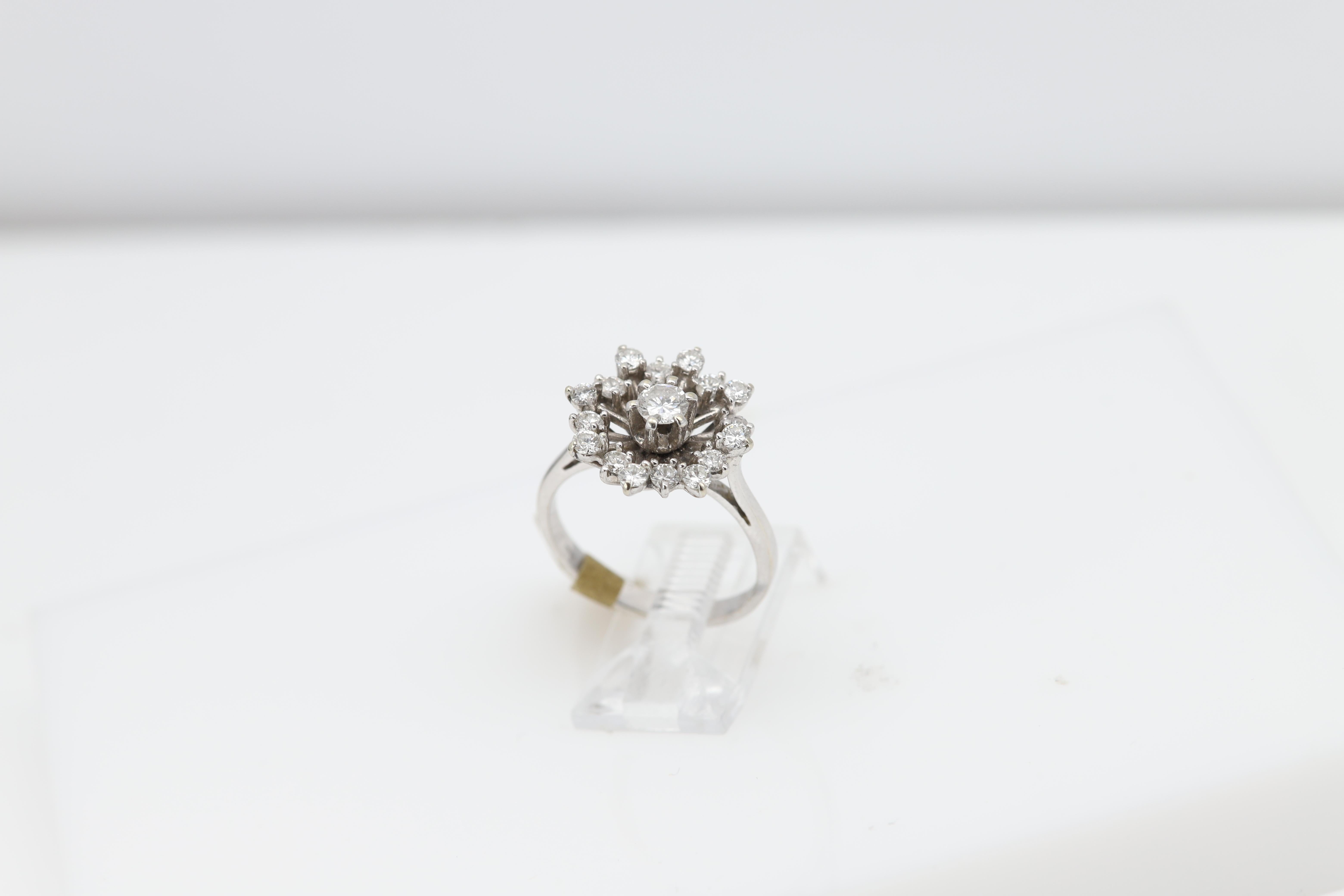 Vintage Diamond Ring circa 1940's or 1950's
Has a simplicity beauty to it, not too gaudy.
has an old fashion style was built the old way.
Diamond is approx 1.00 carat round G-VS very nice quality 
Finger size 6.5
18K White Gold 4.5 grams.
design