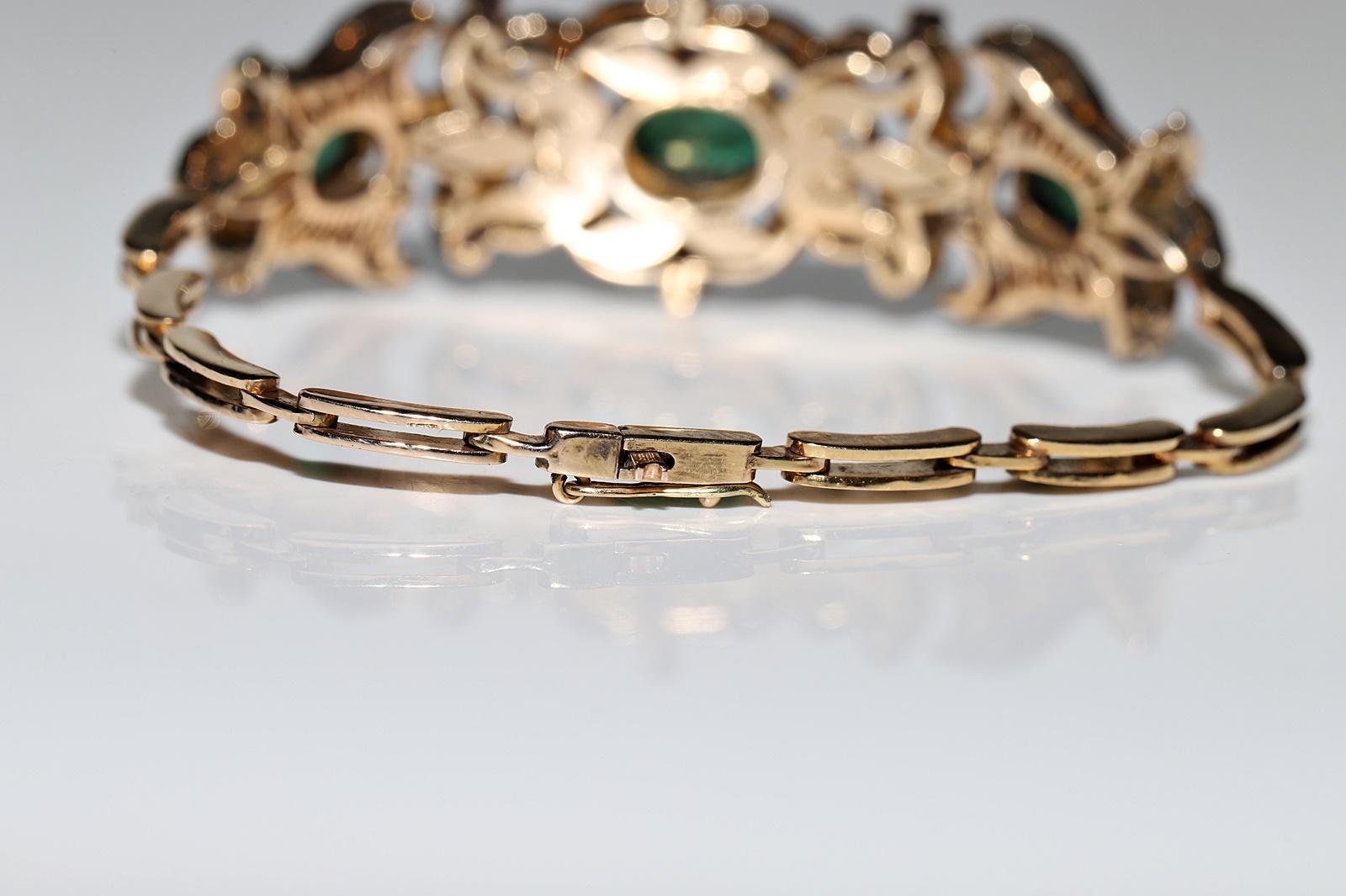 Bracelet vintage des années 1960 en or 14 carats avec diamants naturels, émeraudes et rubis en vente 7