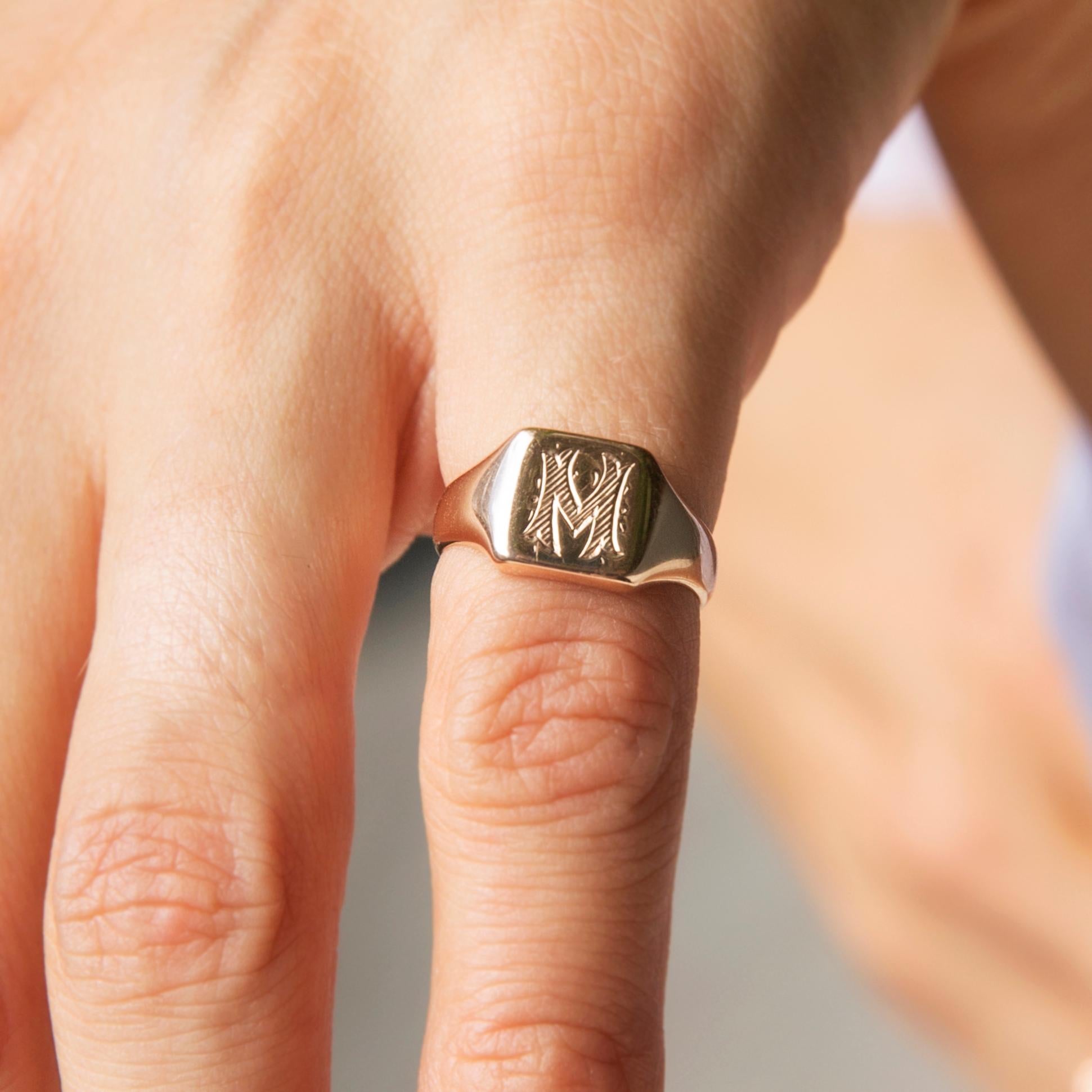 Forged in 18 carat rose gold, this smart vintage signet ring features a cushion-shaped high polish front with a freeform letter M inscribed. This lovely ring is named The Miranda Ring. She is a lovely piece that looks the part no matter the time or