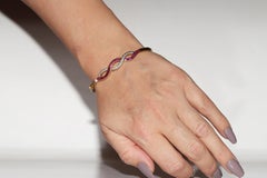 Vintage Circa 1960s 18k Gold Natural Diamond And Caliber Ruby Bangle Bracelet