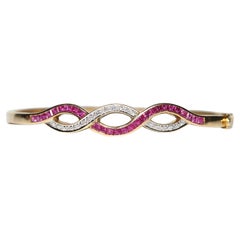 Vintage Circa 1960s 18k Gold Natural Diamond And Caliber Ruby Bangle Bracelet