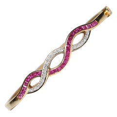 Vintage Circa 1960s 18k Gold Natural Diamond And Caliber Ruby Bangle Bracelet