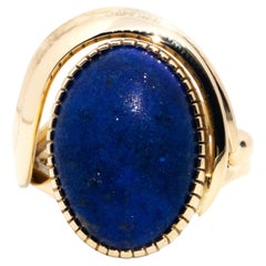 Vintage Circa 1970s 12 Carat Yellow Gold Oval Cabochon Cut Lapis Lazuli Ring