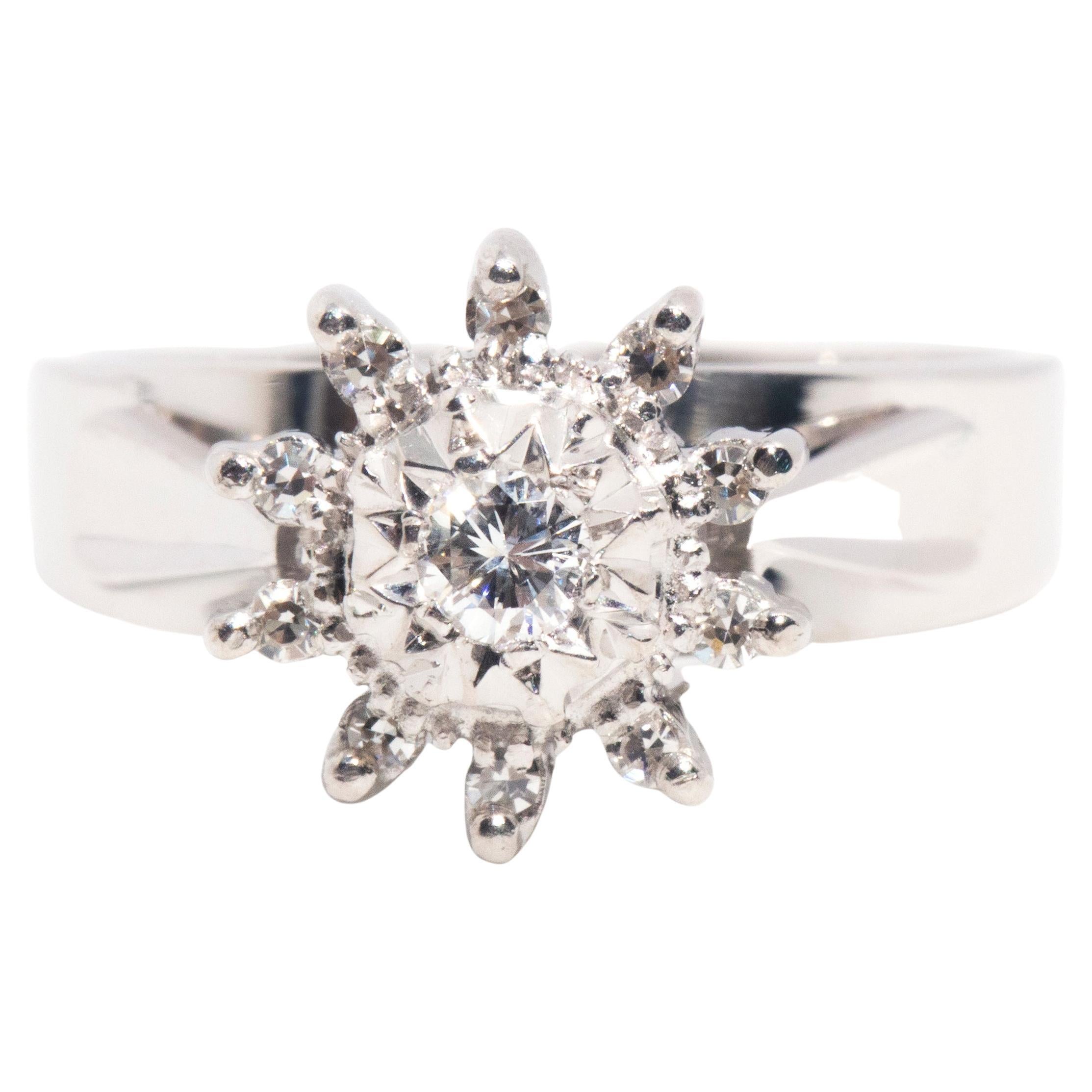 Vintage Circa 1970s 18 Carat White Gold Diamond Halo Cluster Engagement Ring For Sale