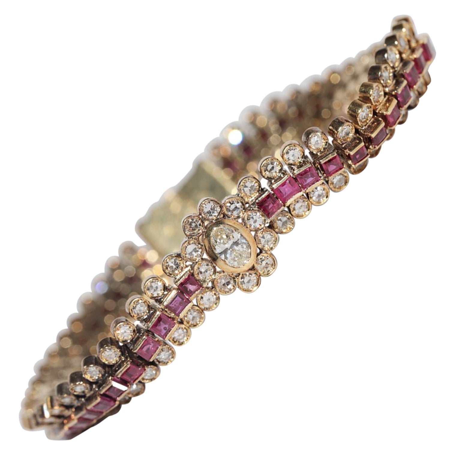 Vintage Circa 1970s 18k Gold Natural Diamond And Caliber Cut Ruby Bracelet For Sale