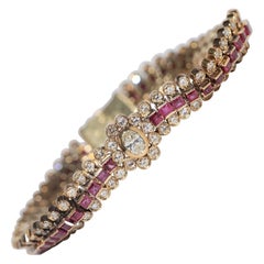 Vintage Circa 1970s 18k Gold Natural Diamond And Caliber Cut Ruby Bracelet