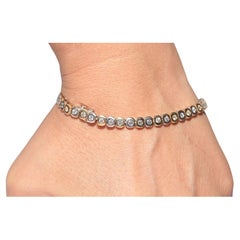 Vintage Circa 1970 Bracelet de tennis en or 18k orné de diamants naturels