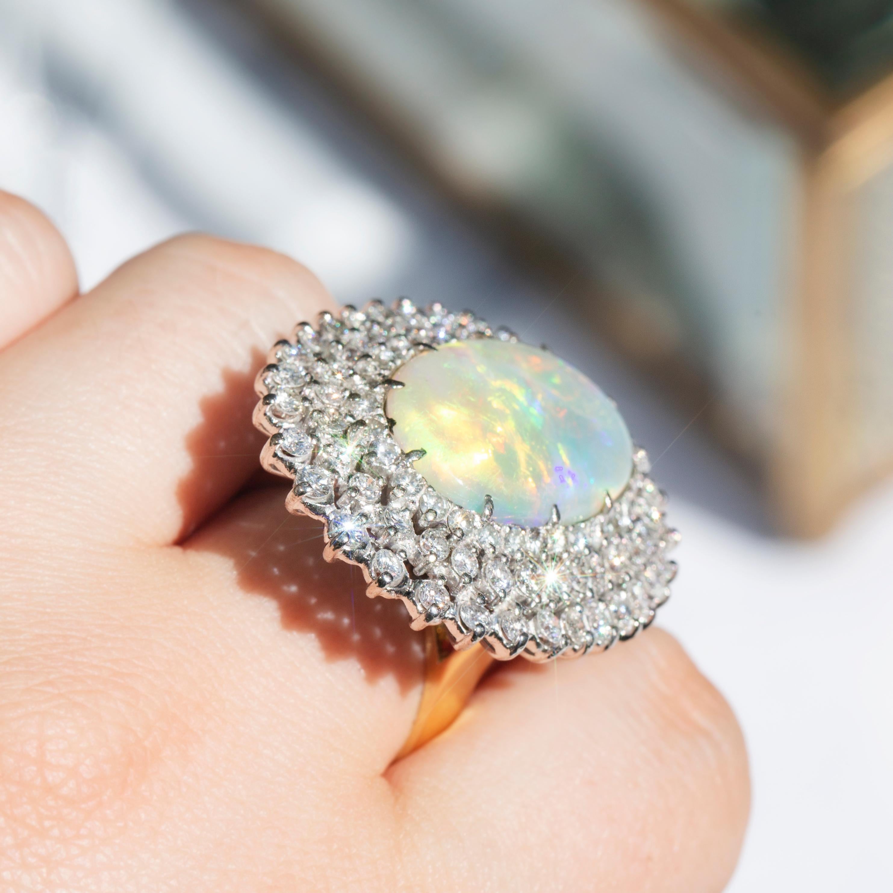 Vintage Circa 1970s Australian Oval Solid Opal & Diamond Halo Ring 18 Carat Gold In Good Condition For Sale In Hamilton, AU