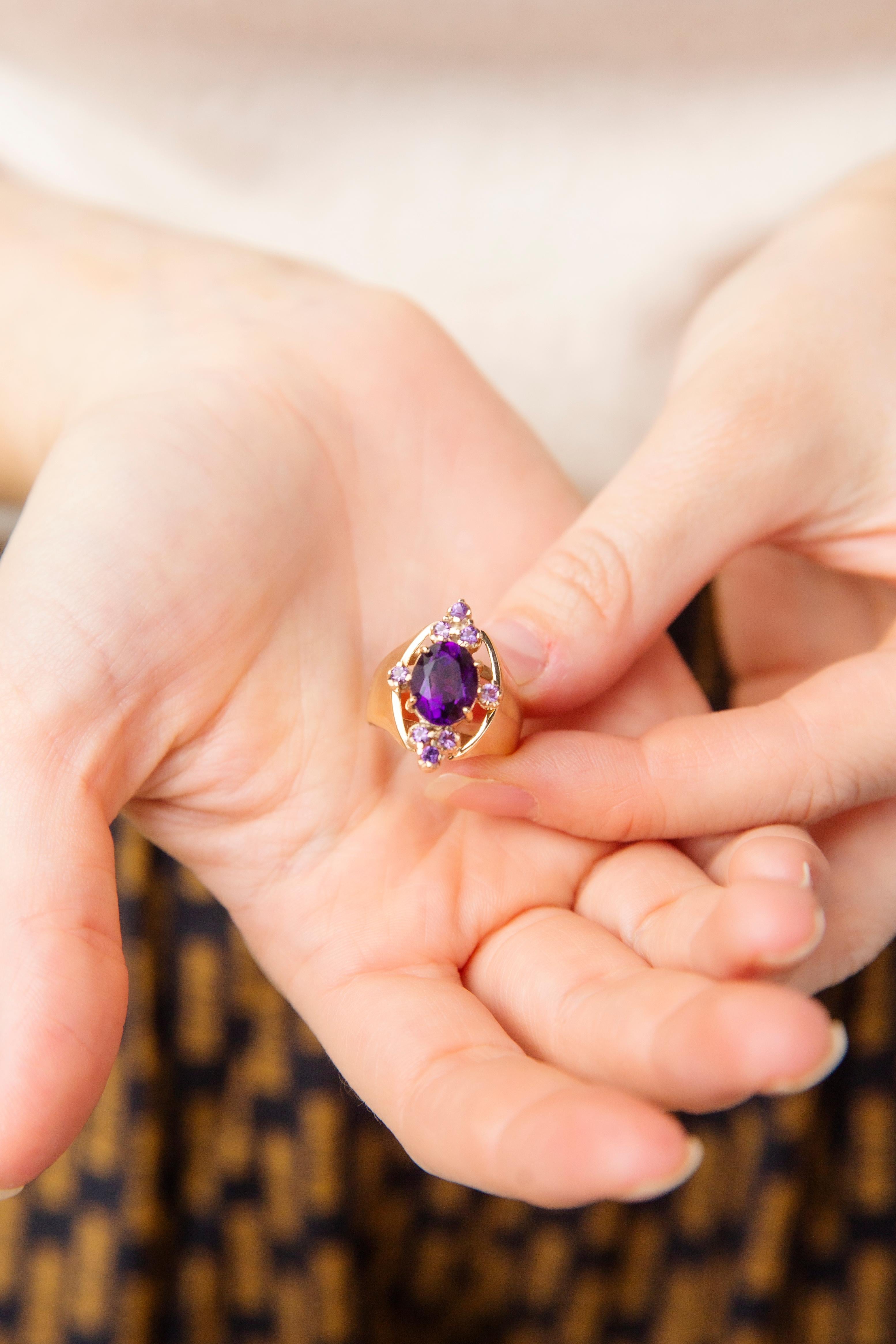 Expertly crafted in 9 carat gold, The Cordelia Ring is a stunning vintage jewel. Her ample band rises to an oval setting crowned with vivid amethysts that move and dance in the twinkling of evening lights, evoking memories of balmy midnight