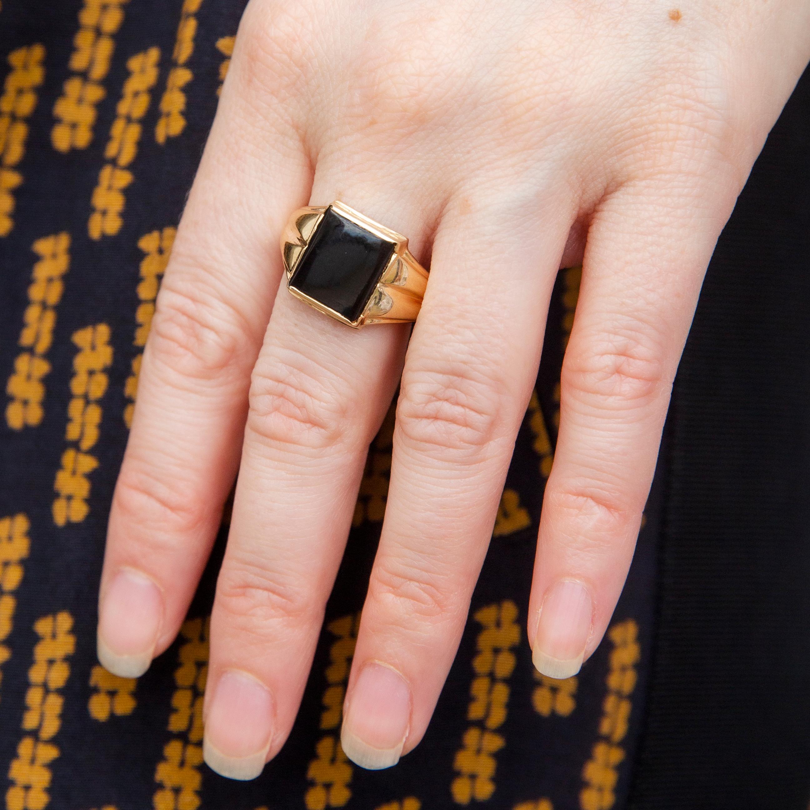 Expertly crafted in 9 carat gold, The Melia Ring makes a strong statement. A wide grooved band that lifts and frames a midnight onyx presenting an unadorned visage to the world. An urbane inclusion in any collection.

The Melia Ring Gem Details
The