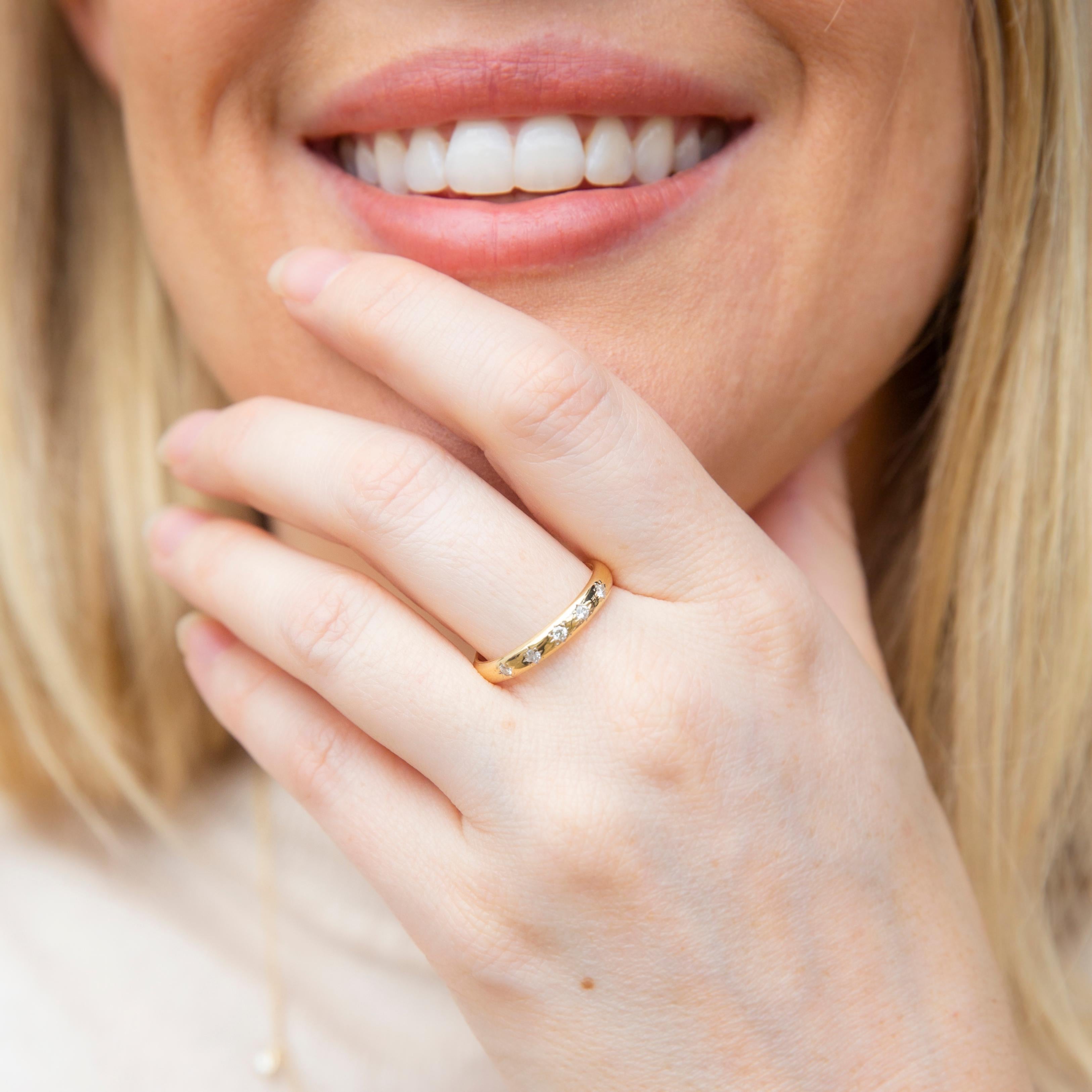 Crafted in 18 carat gold, The Selma Ring is a classic jewel set with five sparkling diamonds around her elegant curved front. A wonderful symbol of shared love, where two hearts beat as one, she is a true darling.

The Selma Ring Gem Details
The