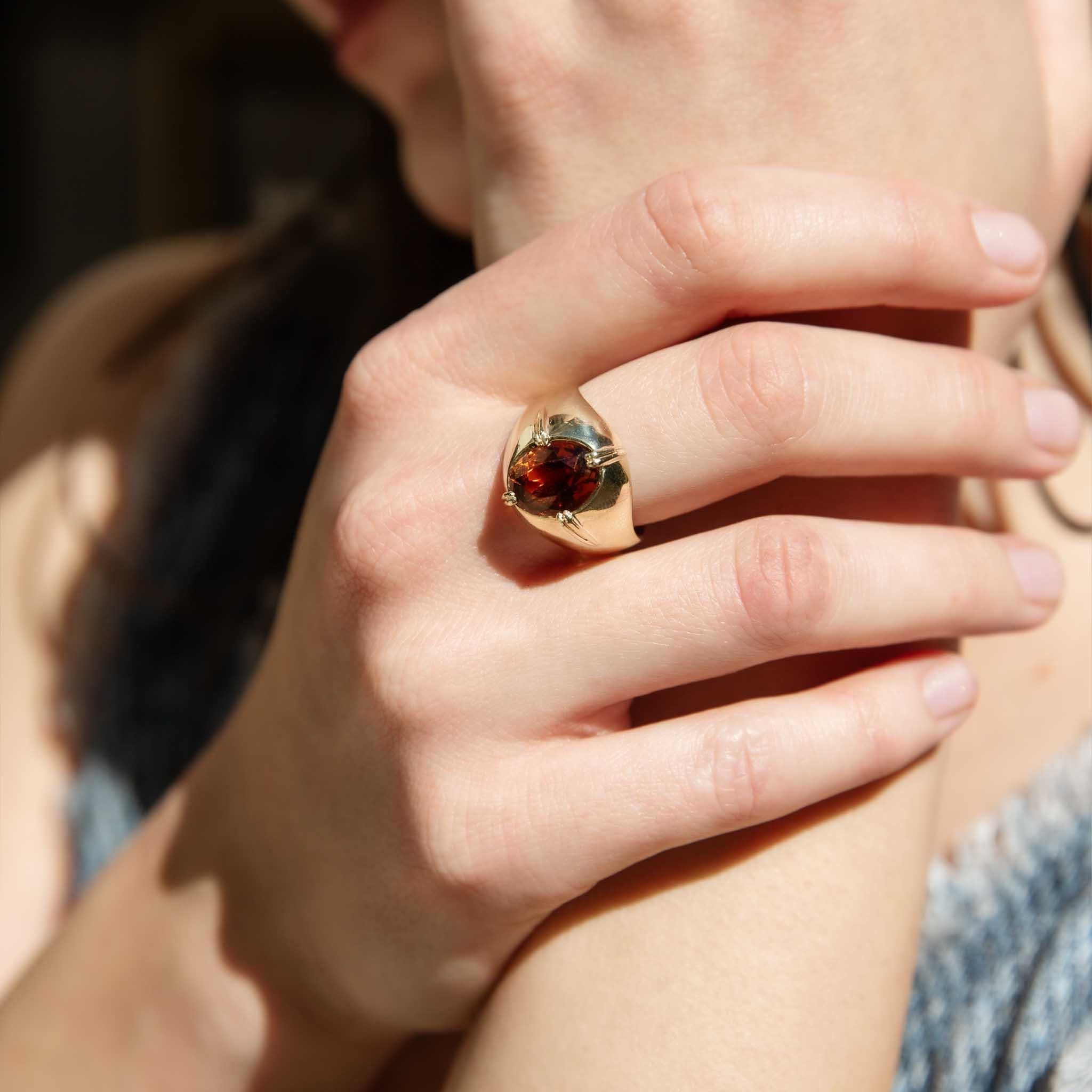 From the era of disco, punk and soul comes our Billie Ring.  Crafted in 14 carat gold, her opulent orange sapphire rests atop her high-polish domed band.  A truly wonderful memory of a time rich in colour and fashion, perfect for your someone