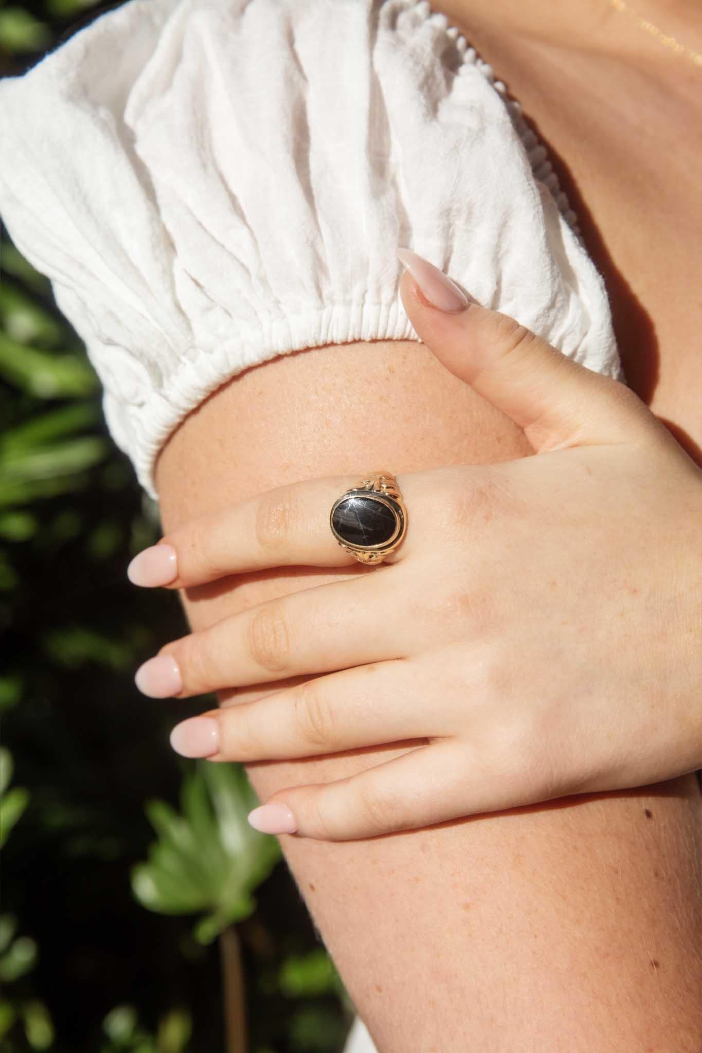 Our Elton Ring has been handsomely crafted in 9 carat gold and inlaid with polished onyx. Filigreed shoulders reach toward the midnight onyx resting in it's frame of rich gold. A stylish gift for your someone special.

The Elton Ring Gem Details
The