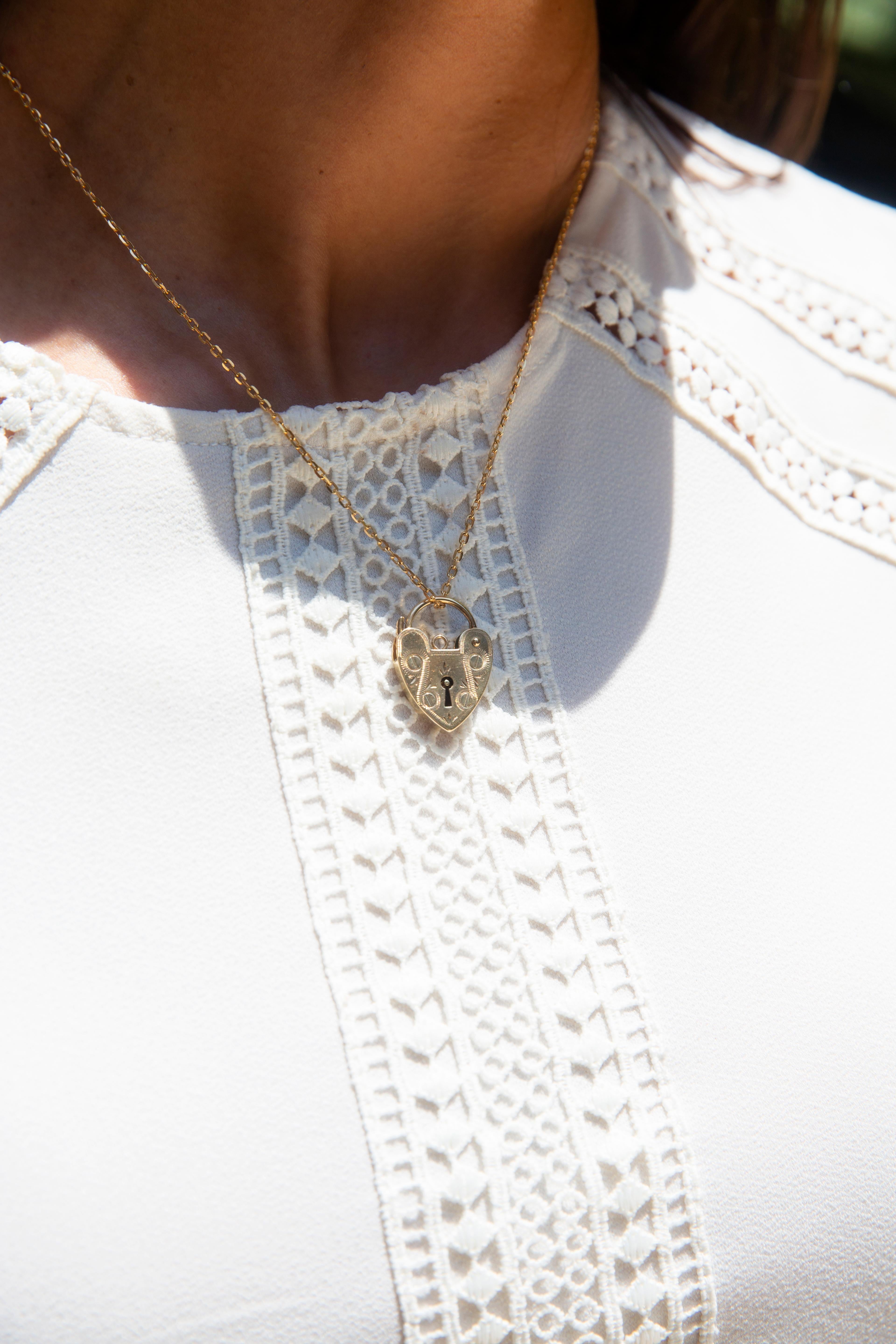 Our gorgeous circa 1970s Ariana heart padlock & chain is beautifully crafted in 9 carat gold. With her sweet symmetry of engraving she is a delightful vintage whimsy. For the one who holds your heart, may this heart be close to hers.

Size 
The