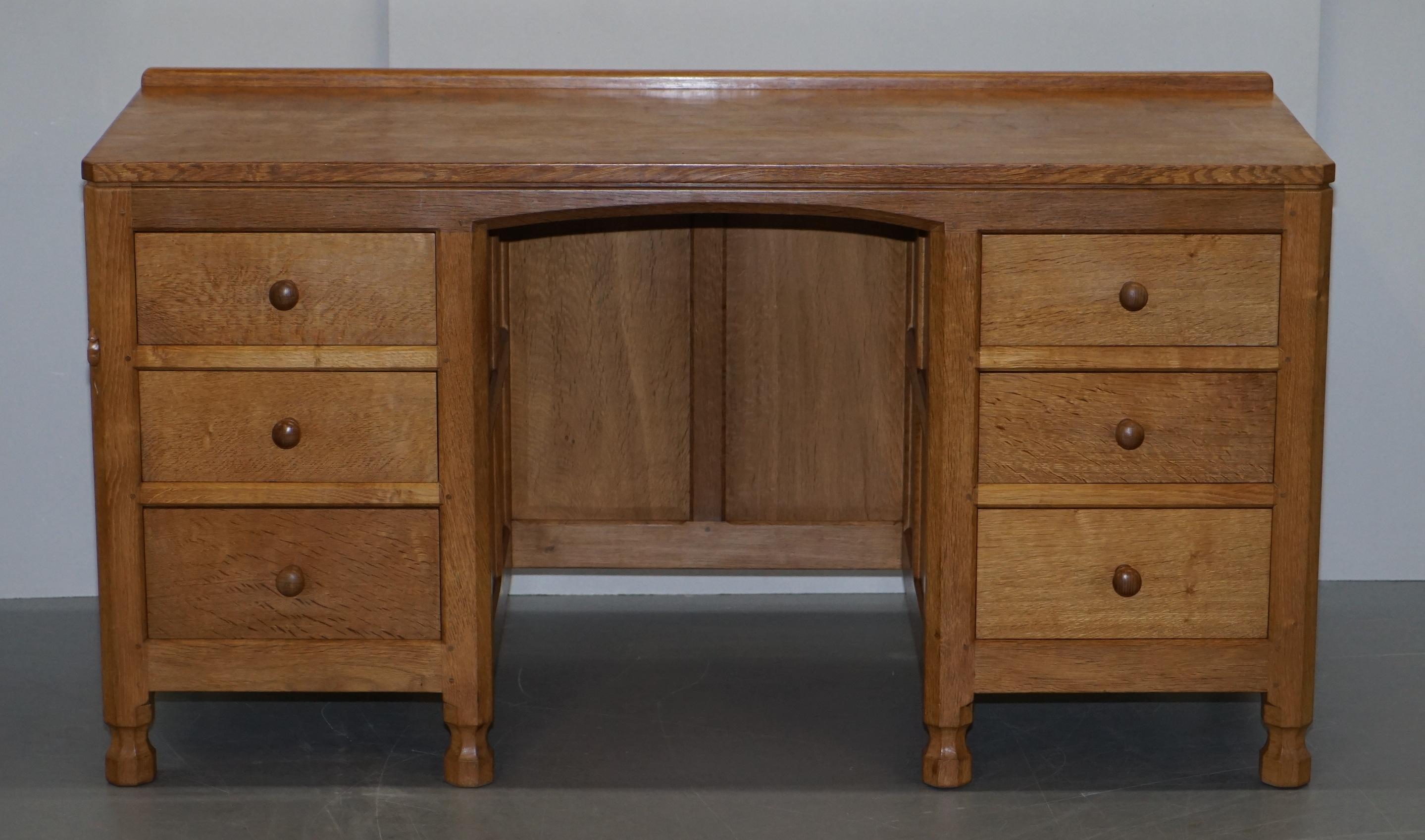 We are delighted to offer for sale this lovely vintage circa 1970s Robert Mouseman Thompson kneehole desk or dressing table

This piece is part of a collection of some very rare Mouseman pieces I have recently purchases, I have a Kneehole desk, a