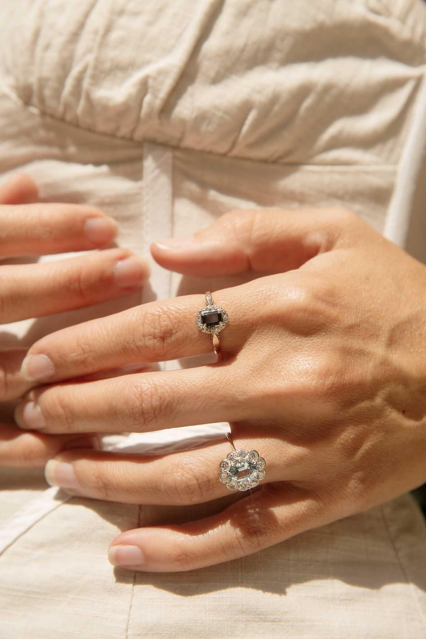 The Tiago Gold Sapphire Diamond Ring captures the deep allure of a twilight sky. Its emerald-cut sapphire, with its rich, velvety blue hue, is surrounded by a halo of sparkling diamonds, all set in 18-carat gold. Tiago is a captivating blend of