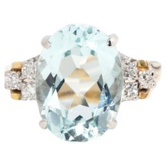 Vintage circa 1980s 14 Carat Gold Diamond & Bright Light Oval Aquamarine Ring