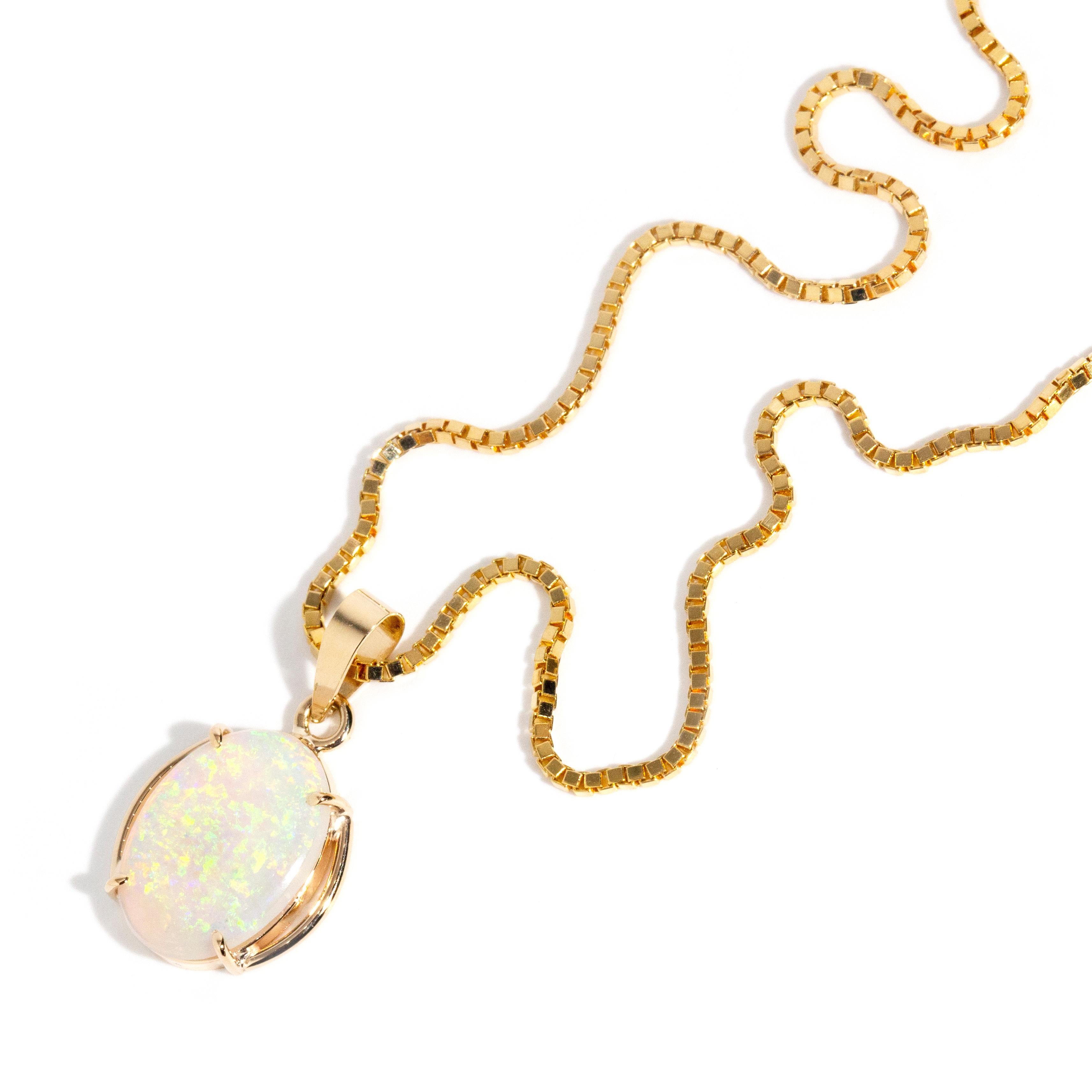 Modern Vintage circa 1980s 14 Carat Yellow Gold Oval Crystal Opal Pendant & Fine Chain