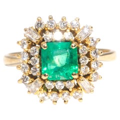 Vintage Circa 1980s 18 Carat Yellow Gold Bright Emerald and Diamond Cluster Ring